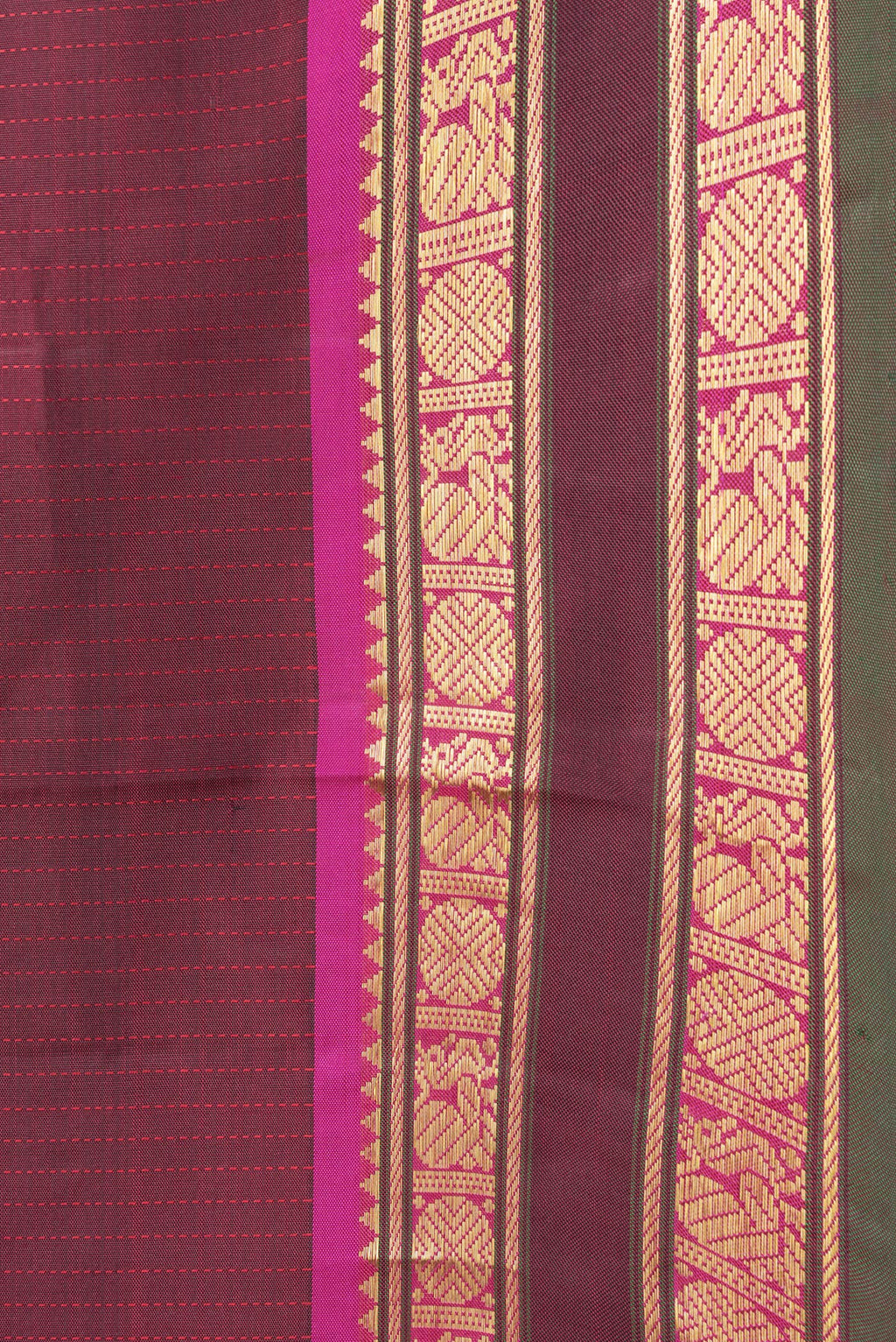 Border image of Maroon Dual Tone Kanjivaram Silk Saree with Stripes on the body and Zari Border. 