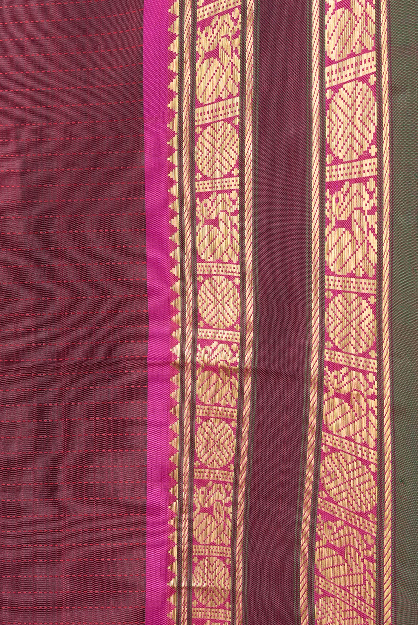 Border image of Maroon Dual Tone Kanjivaram Silk Saree with Stripes on the body and Zari Border. 