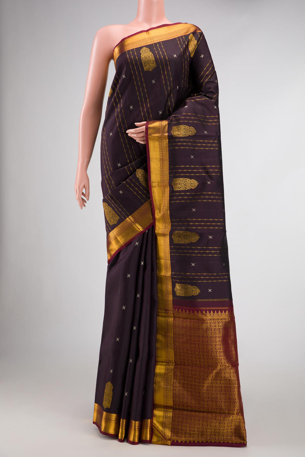 Coffee Brown Dual Tone Kanjivaram Silk Saree with Stripes on the body and Zari Border.  displayed on a mannequin