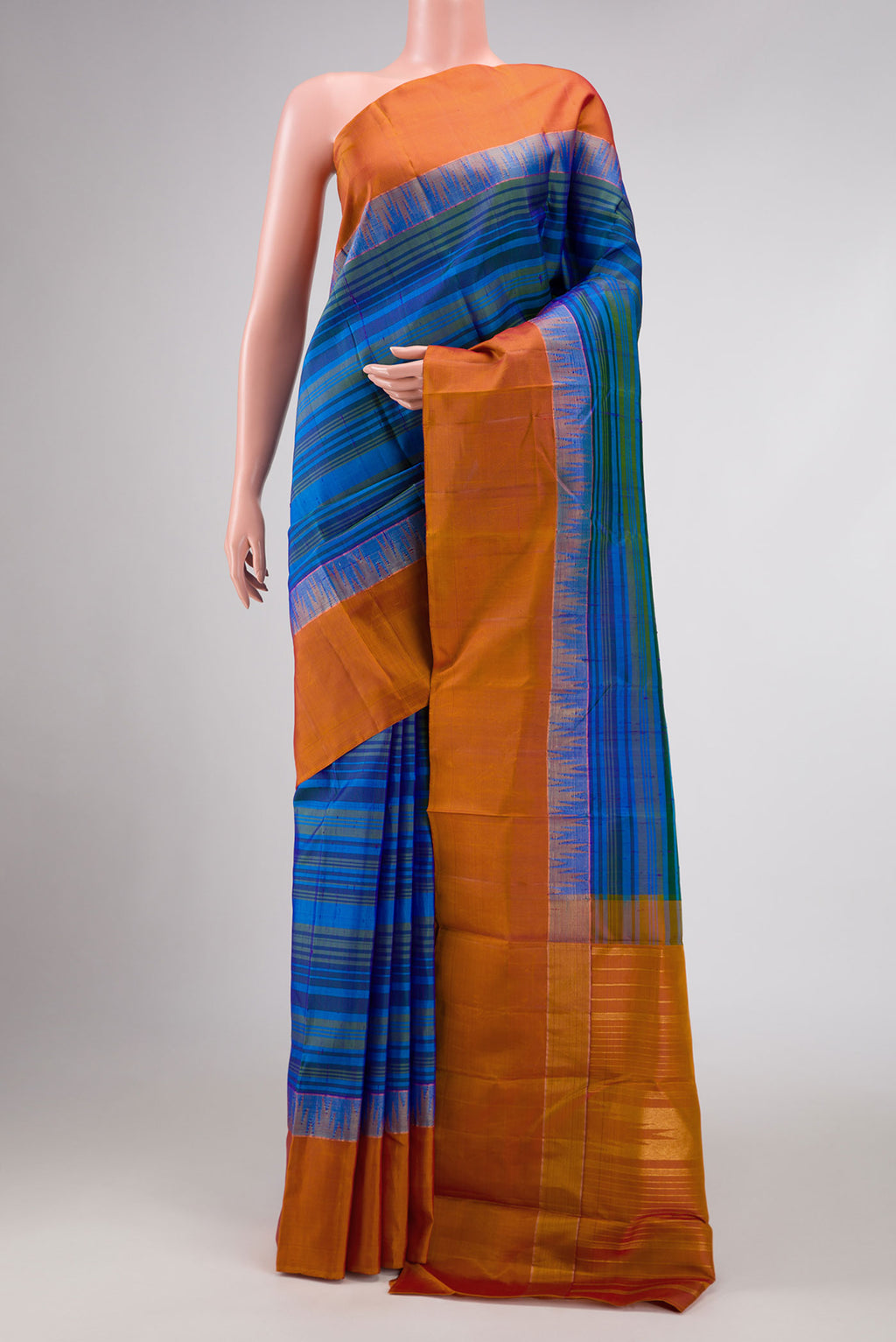 Blue Dual Tone Kanchipuram Silk Saree with Stripes on the body and Zari Border displayed on a mannequin