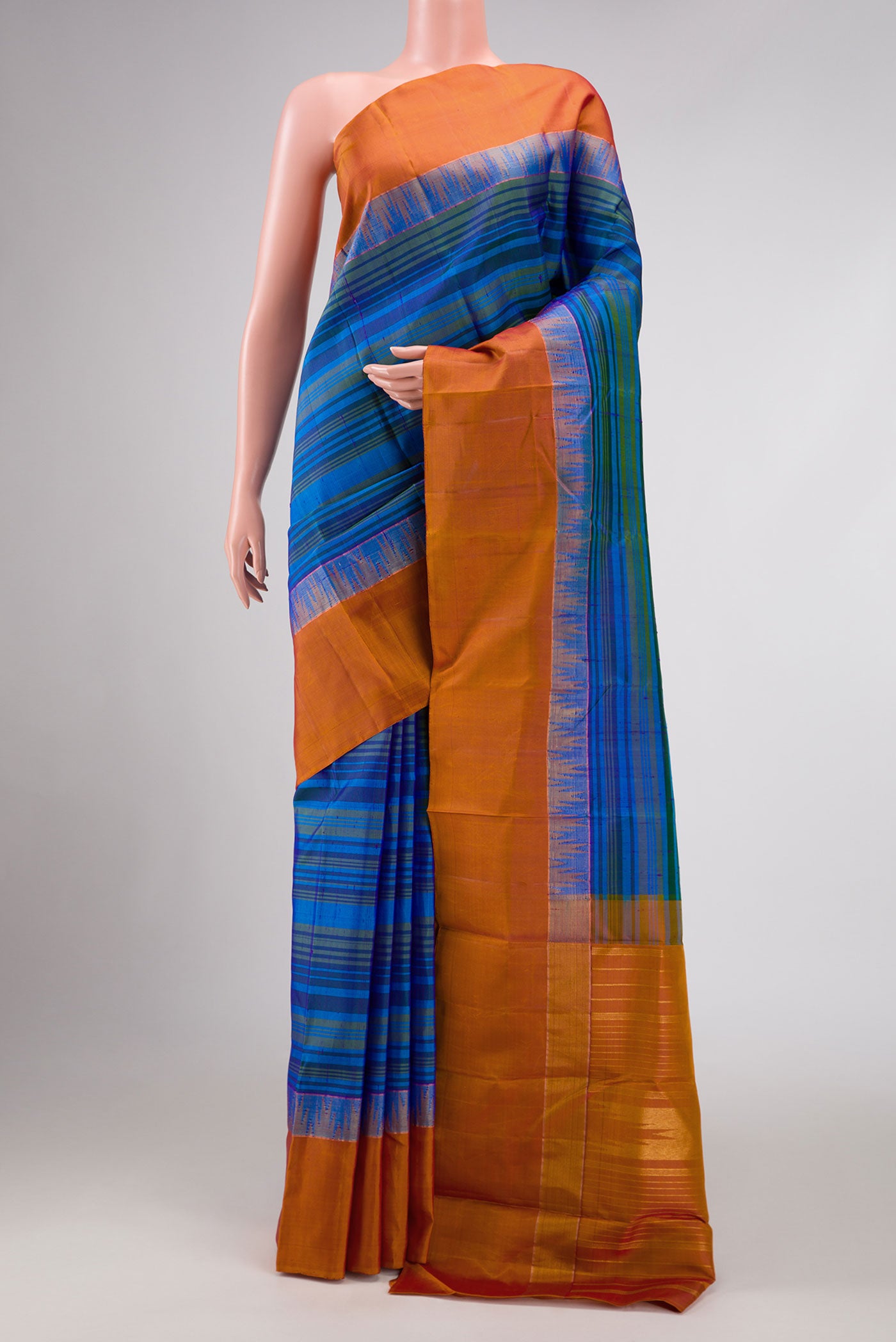 Blue Dual Tone Kanchipuram Silk Saree with Stripes on the body and Zari Border displayed on a mannequin