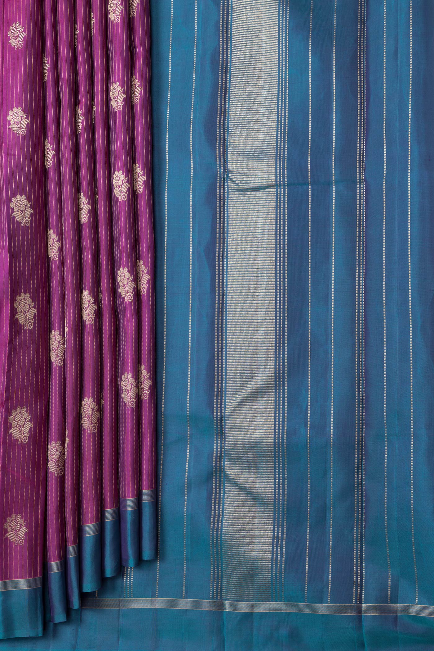 Pleats and pallu of Magenta Dual Tone Kanjivaram Silk Saree with Stripes on the body and Zari Border. 