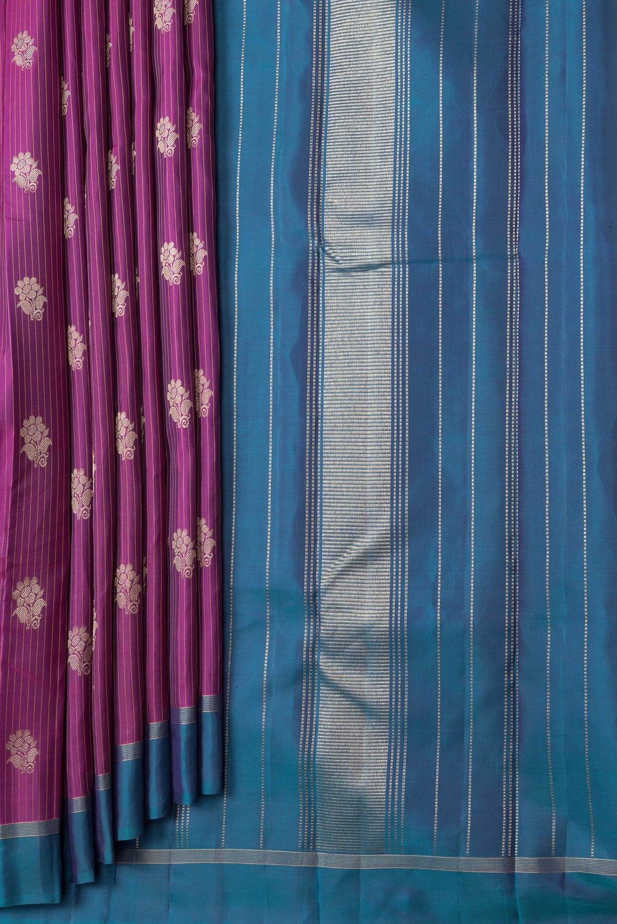 Pleats and pallu of Magenta Dual Tone Kanjivaram Silk Saree with Stripes on the body and Zari Border. 