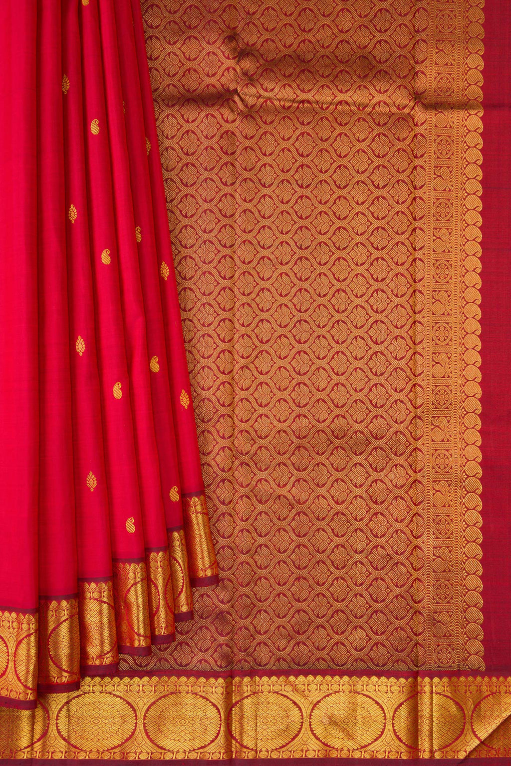 Pleats and pallu of Red Kanchipuram Silk Saree with Zari Butta on the body and Zari Border. 