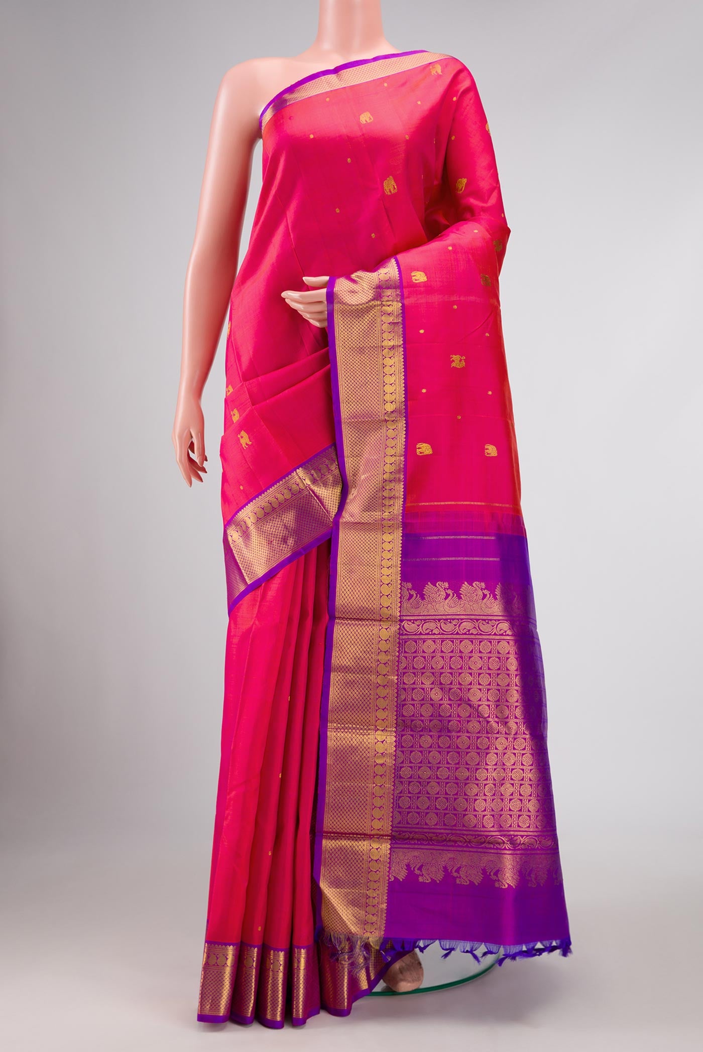 Pure Silk Pure Zari Pink Dual Tone Kanchipuram Saree with Zari Butta on the body and Zari Border displayed on a mannequin