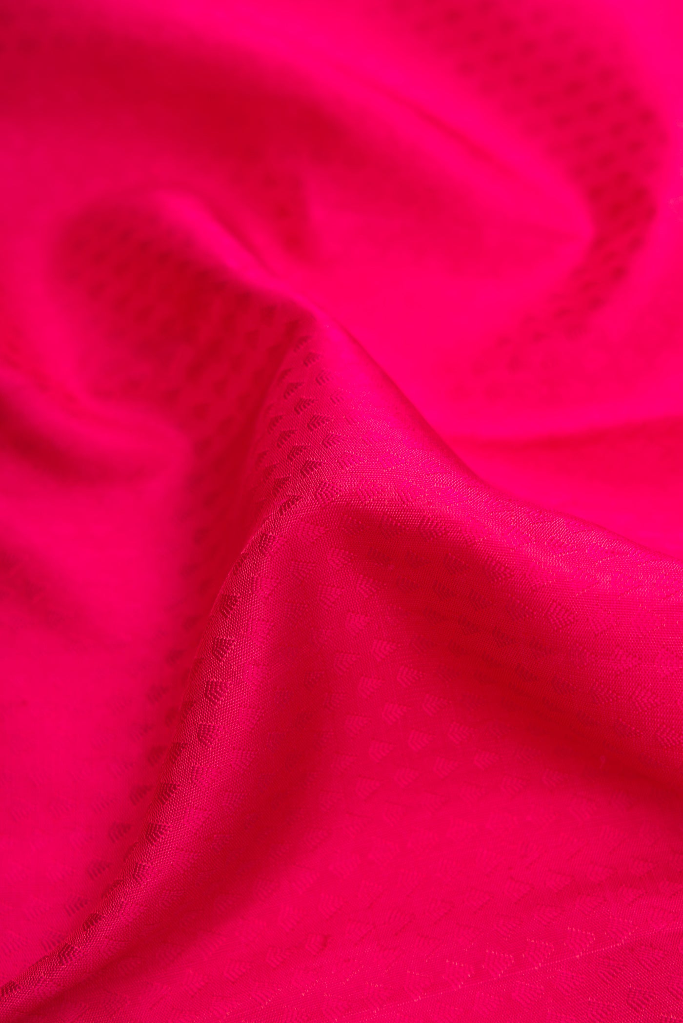 Close up of Pure Silk Pure Zari Dark Pink Dual Tone Kanchipuram Saree with Jacquard design on the body and Zari Border.  displaying folds
