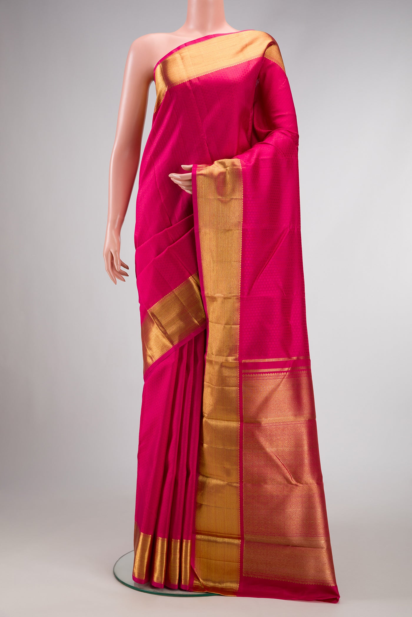 Pure Silk Pure Zari Dark Pink Dual Tone Kanchipuram Saree with Jacquard design on the body and Zari Border.  displayed on a mannequin
