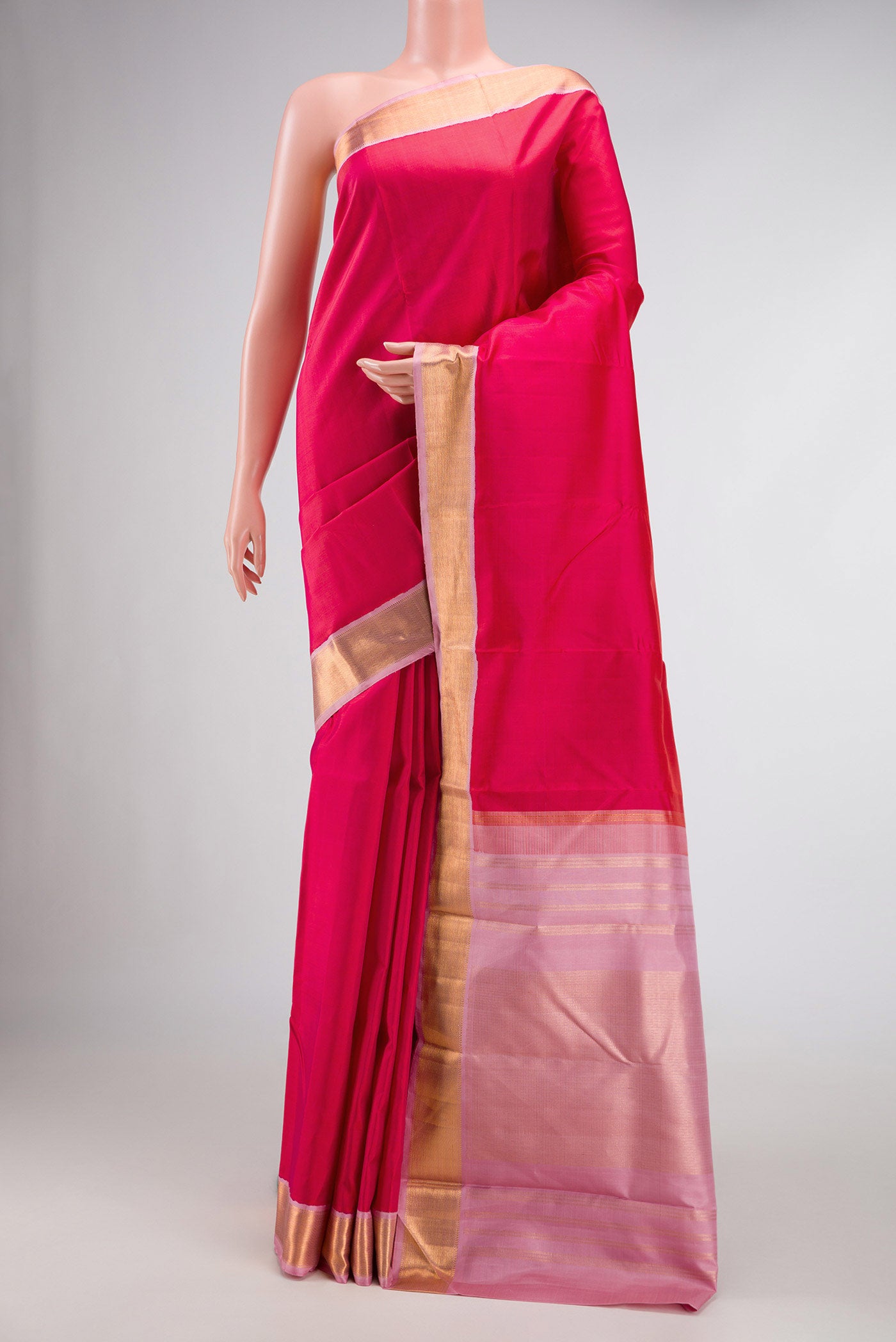 Dark Pink Dual Tone Kanjivaram Silk Saree with Plain Body and Zari Border.  displayed on a mannequin