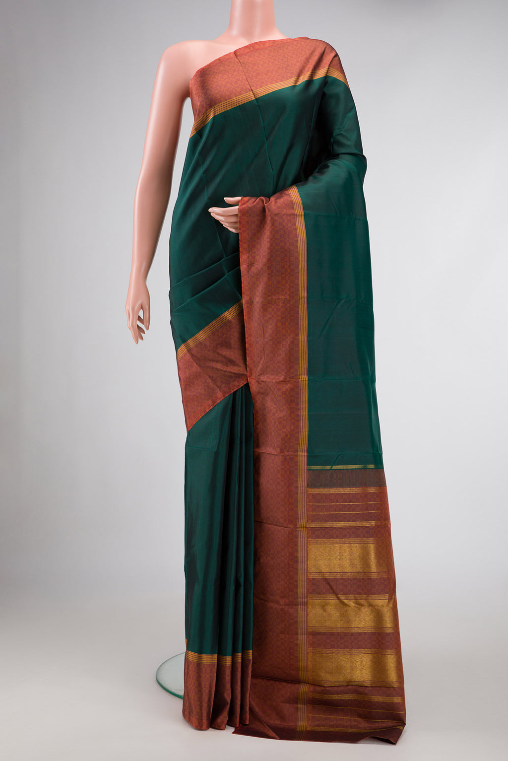 Bottle Green Dual Tone Kanchipuram Silk Saree with Plain Body and Checks Border.  displayed on a mannequin