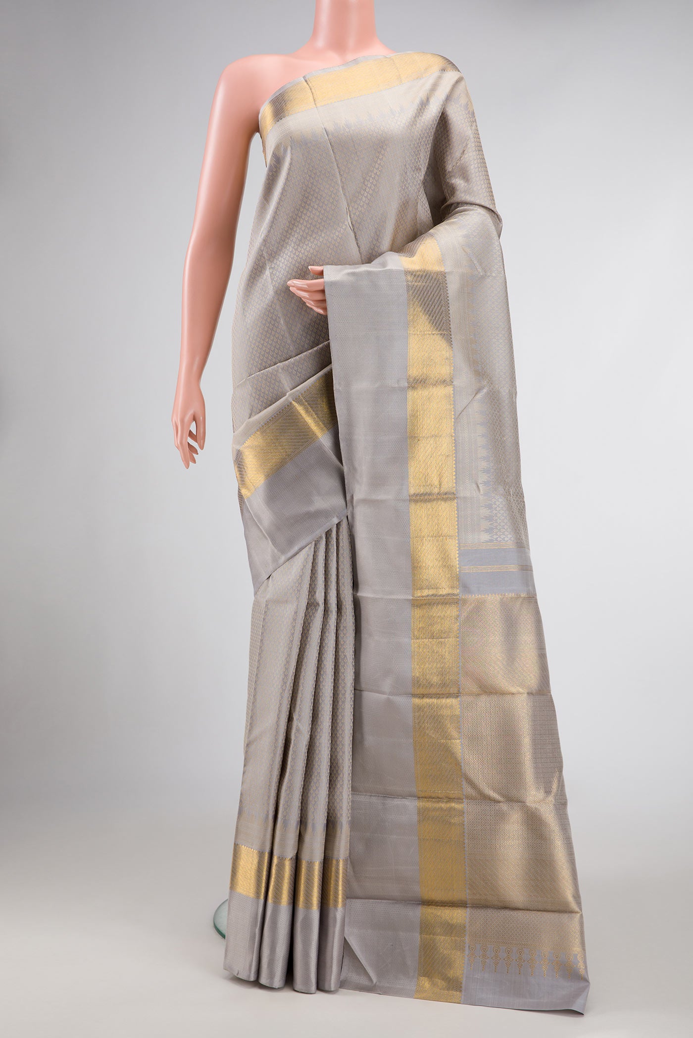 Grey Dual Tone Kanjivaram Silk Saree with Jacquard design on the body and Zari And Thread Border.  displayed on a mannequin