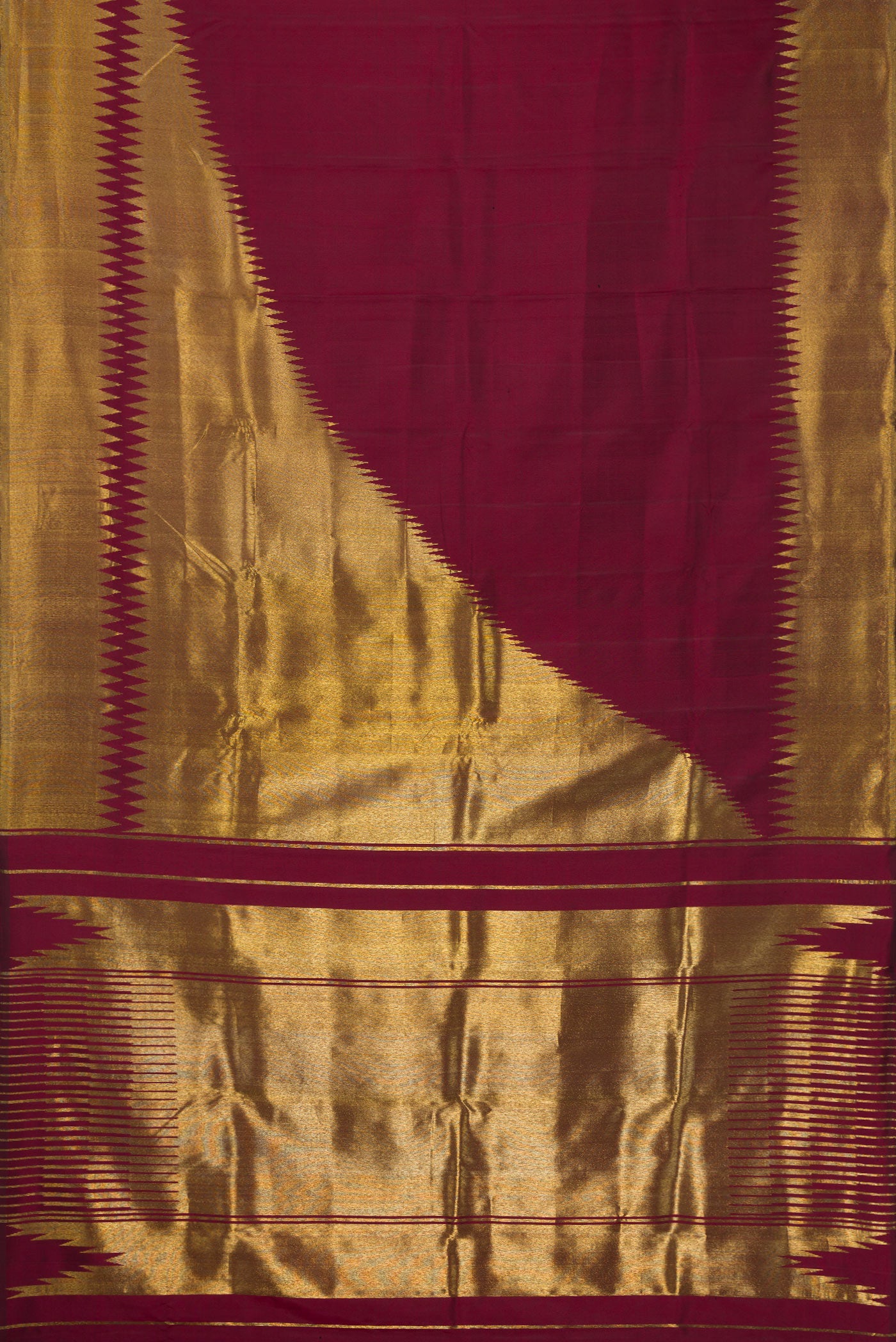 Flat view of Pure Silk Pure Zari Maroon Dual Tone Kanchipuram Saree with Plain Body and Rising Temple Border. 