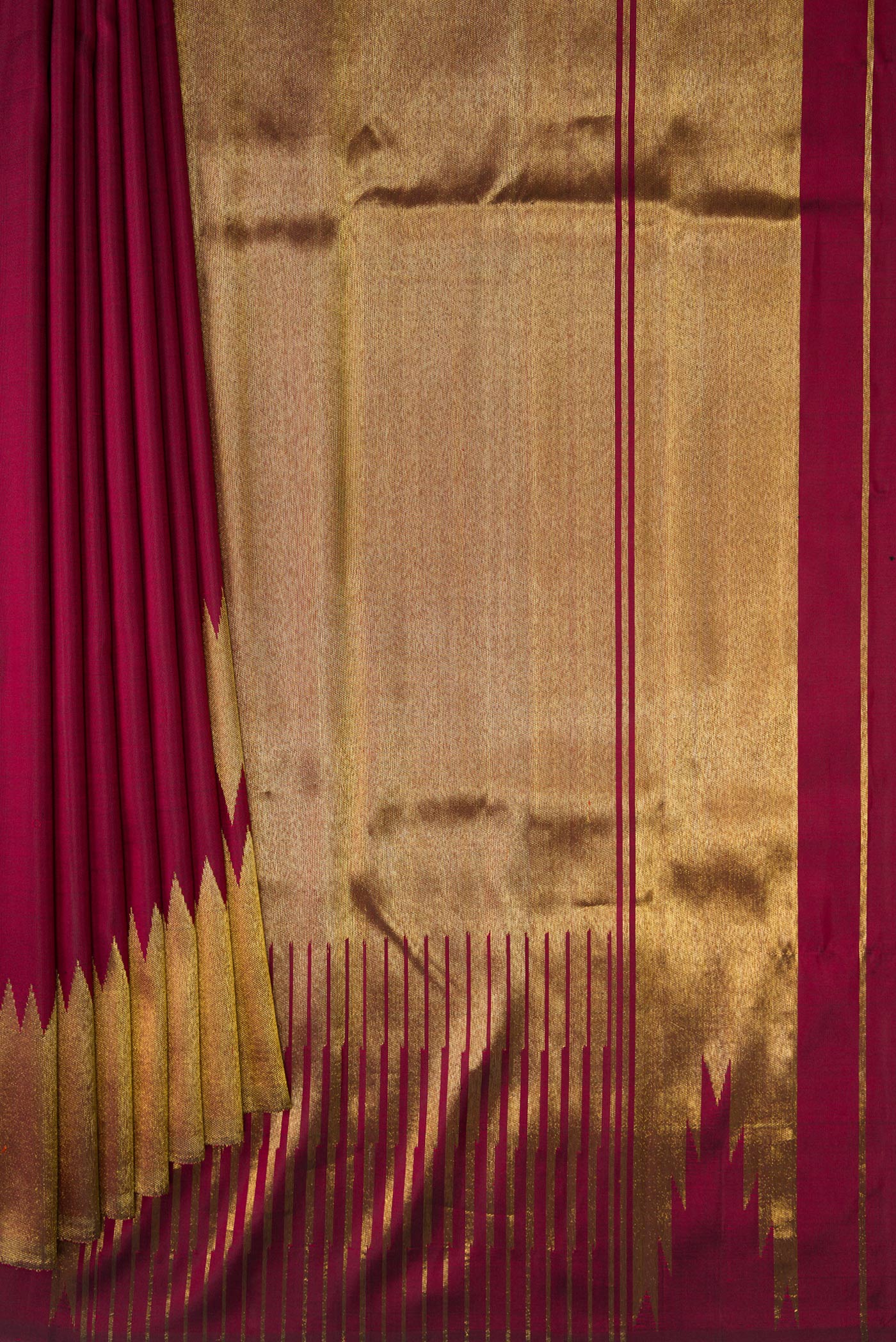 Pleats and pallu of Pure Silk Pure Zari Maroon Dual Tone Kanchipuram Saree with Plain Body and Rising Temple Border. 