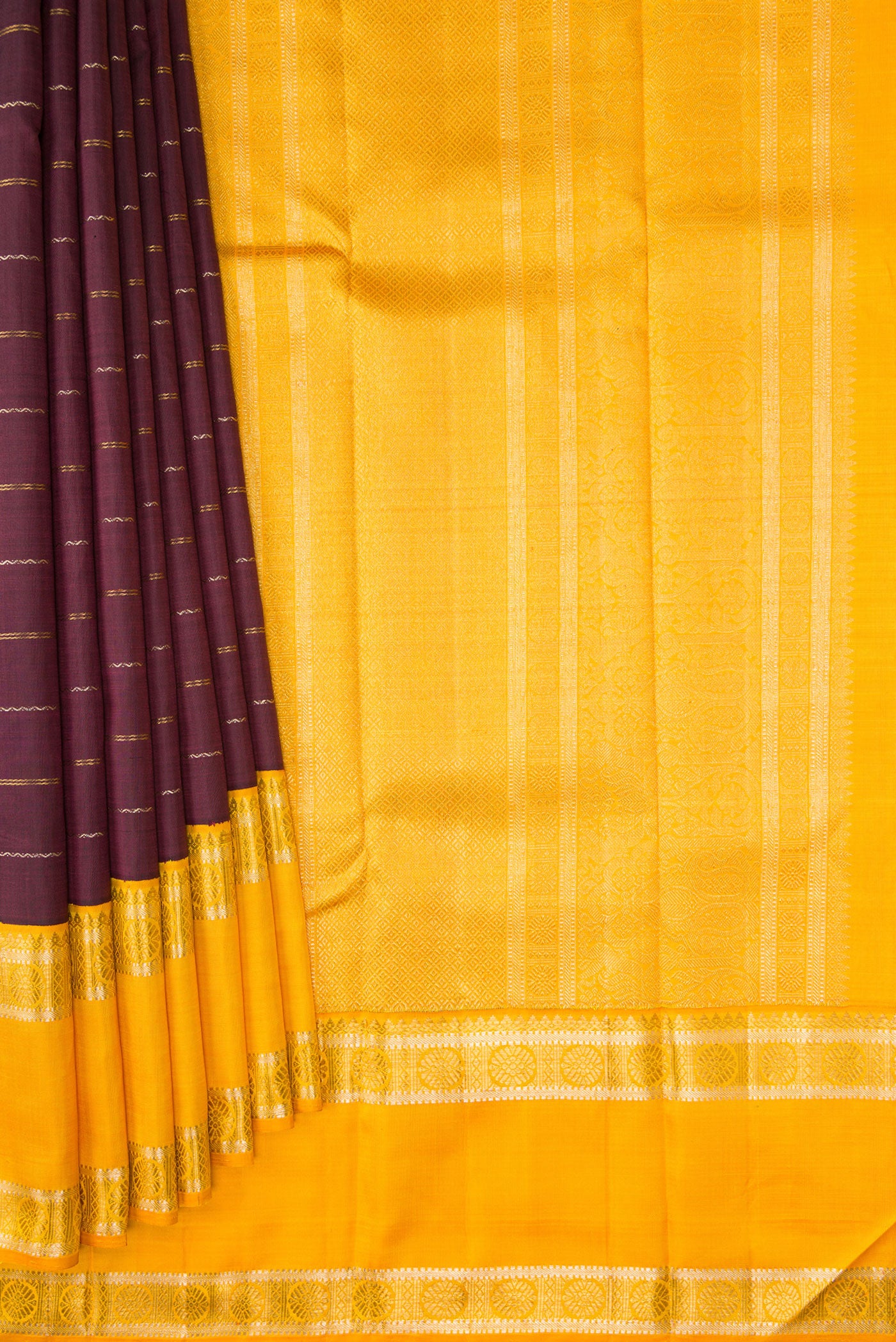 Pleats and pallu of Coffee Brown Dual Tone Kanchipuram Silk Saree with Stripes on the body and Ganga Jamuna Border. 