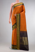 Mustard Dual Tone Kanjivaram Silk Saree with Checked design on the body and Zari Border.  displayed on a mannequin