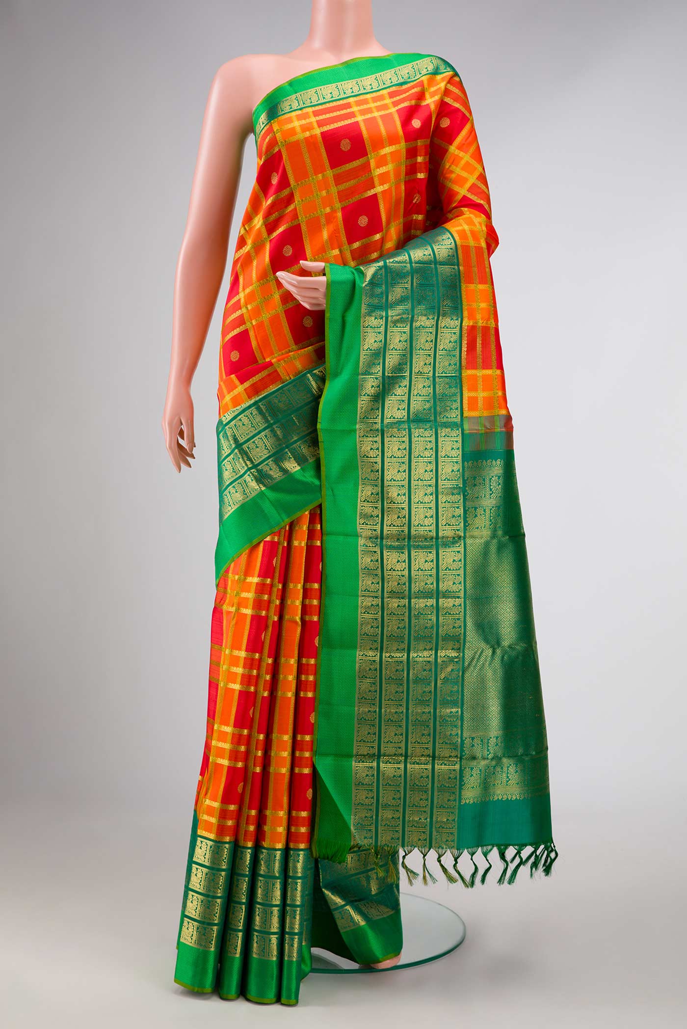 Pure Silk Pure Zari Orange Dual Tone Kanchipuram Saree with Checked design on the body and Zari Border displayed on a mannequin