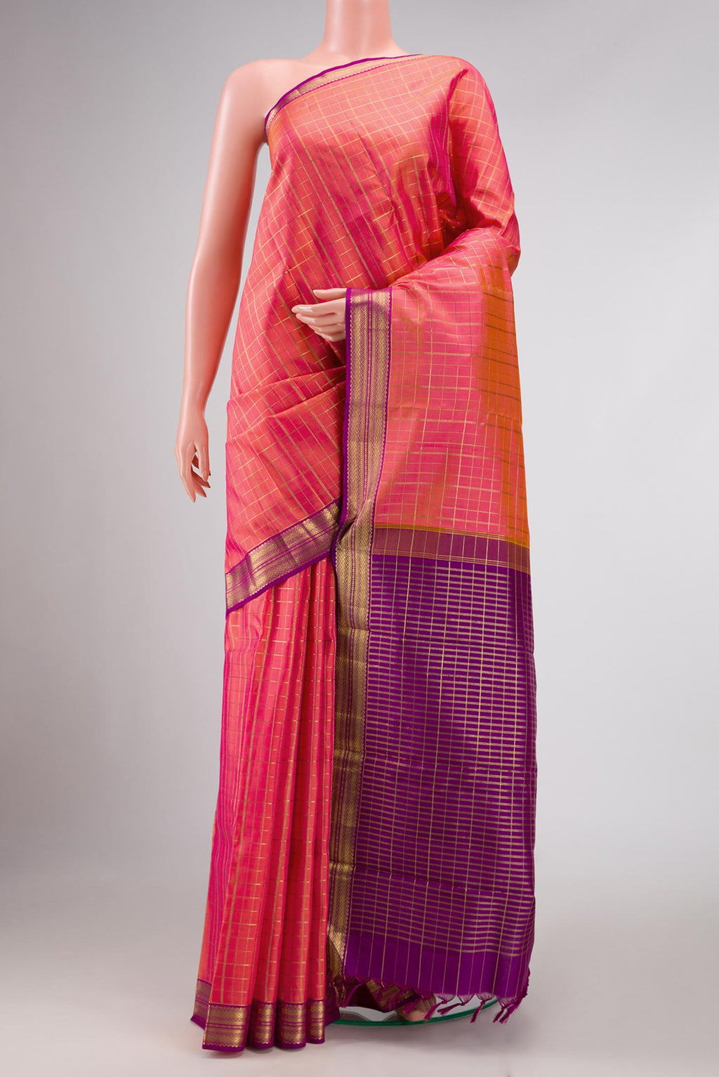 Pink with Orange Color Kanchipuram Silk Saree with Checked design on the body and Zari Border displayed on a mannequin