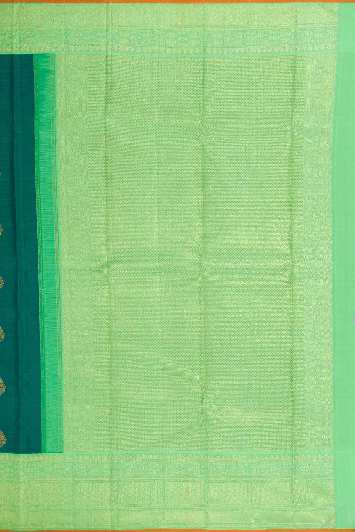 Close up image of the pallu of Pure Silk Pure Zari Green Dual Tone Kanchipuram Saree with Zari Butta on the body and Zari Border