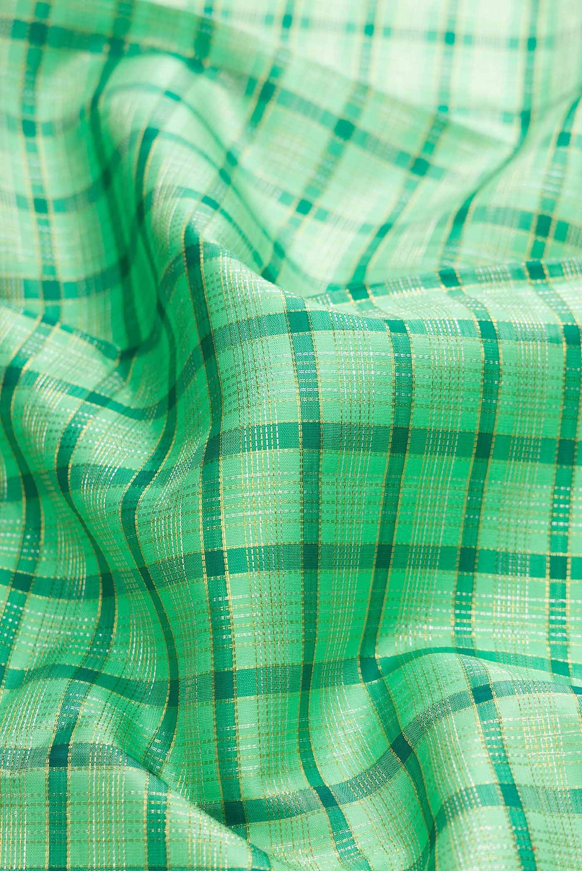 Close up of Pure Silk Pure Zari Sea Green Dual Tone Kanchipuram Saree with Checked design on the body and Zari Border displaying folds