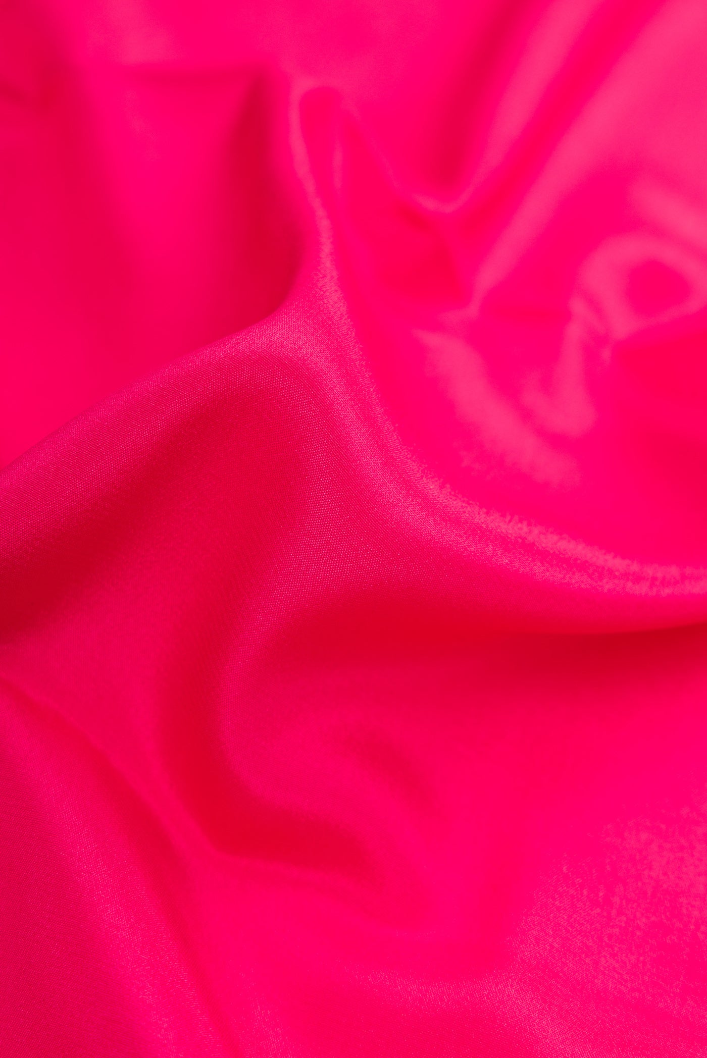 Close up of Pink Mysore Crepe Saree with Plain Body and Zari Border.  displaying folds