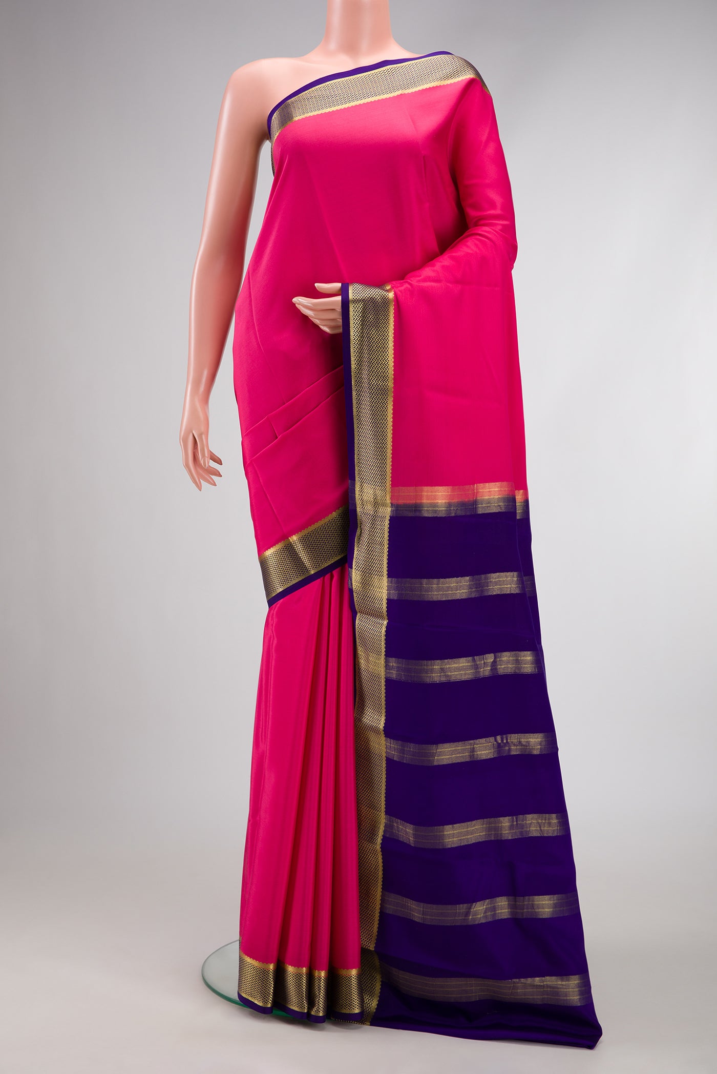 Pink Mysore Crepe Saree with Plain Body and Zari Border.  displayed on a mannequin