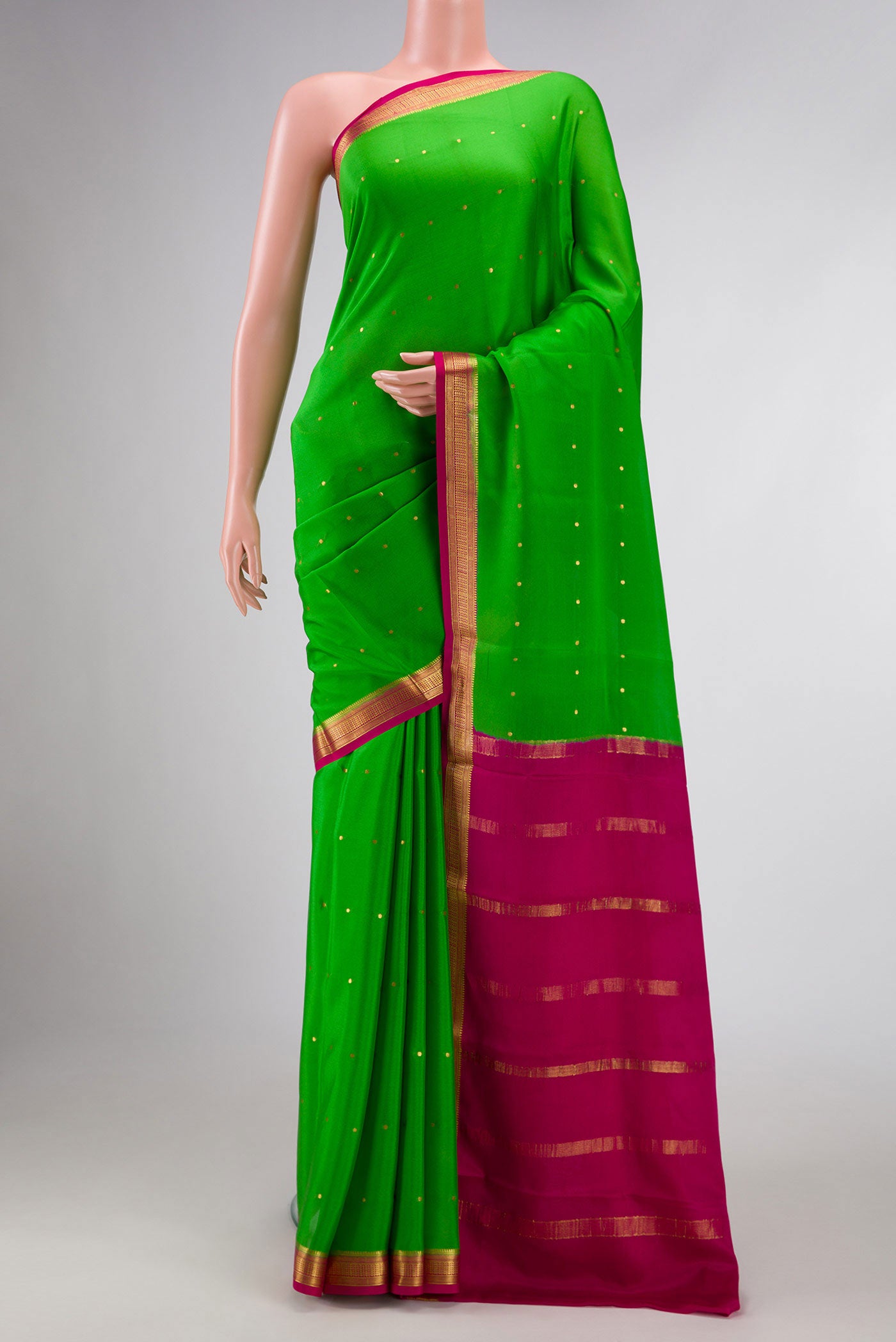 Parrot Green Dual Tone Mysore Crepe Saree with Zari Butta on the body and Zari Border displayed on a mannequin