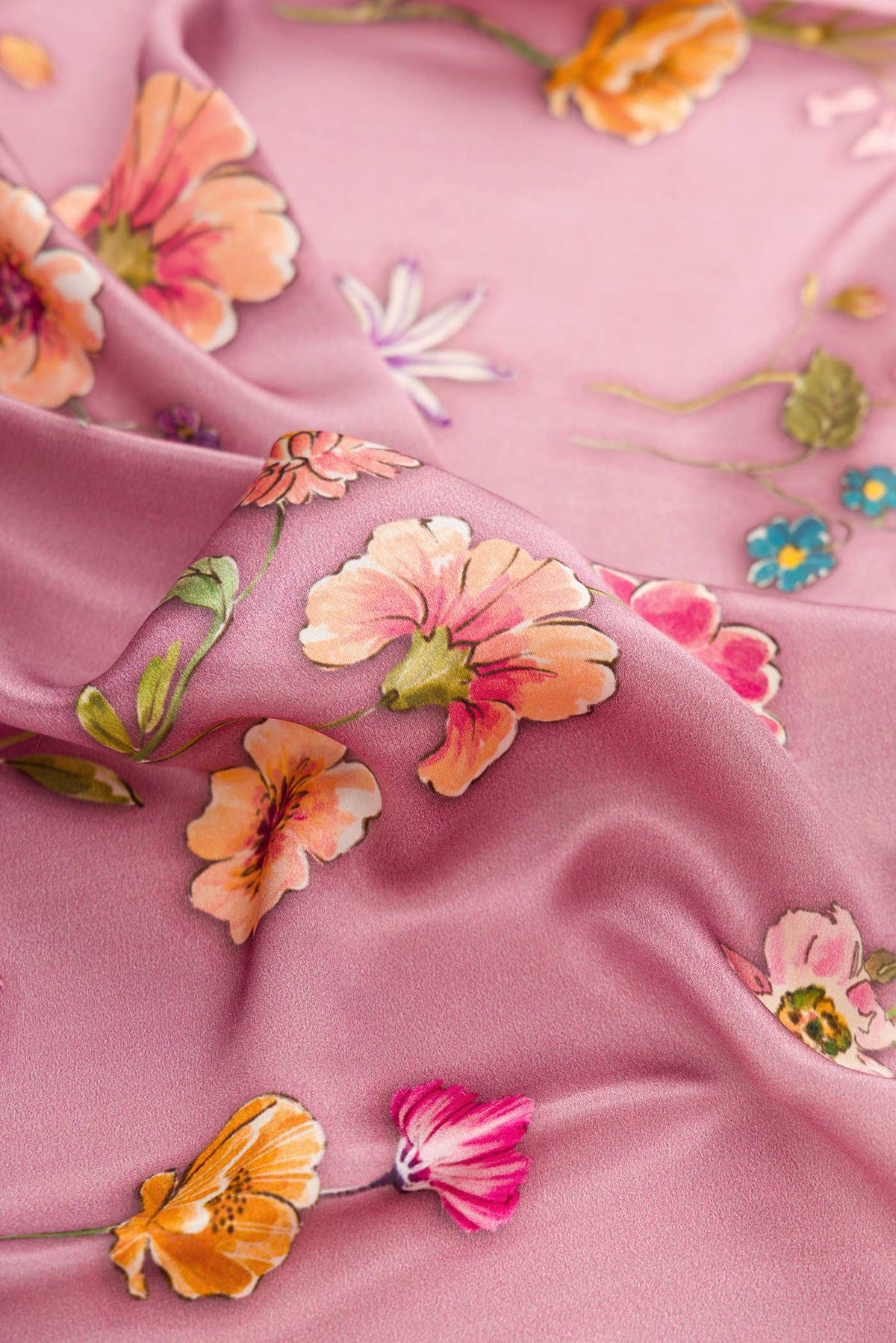 Close up of Pink Dual Tone Mysore Georgette SareePrinted design on the body and Plain Border displaying folds