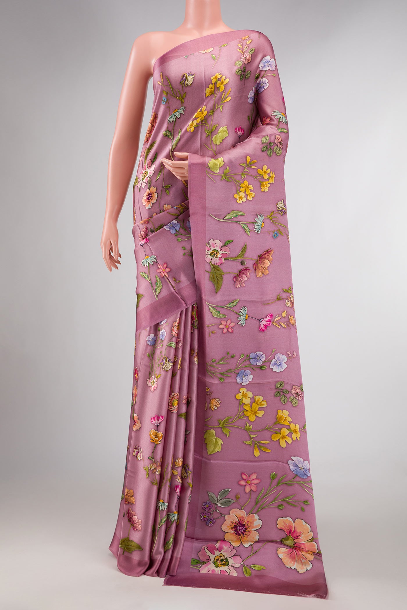 Pink Dual Tone Mysore Georgette SareePrinted design on the body and Plain Border displayed on a mannequin