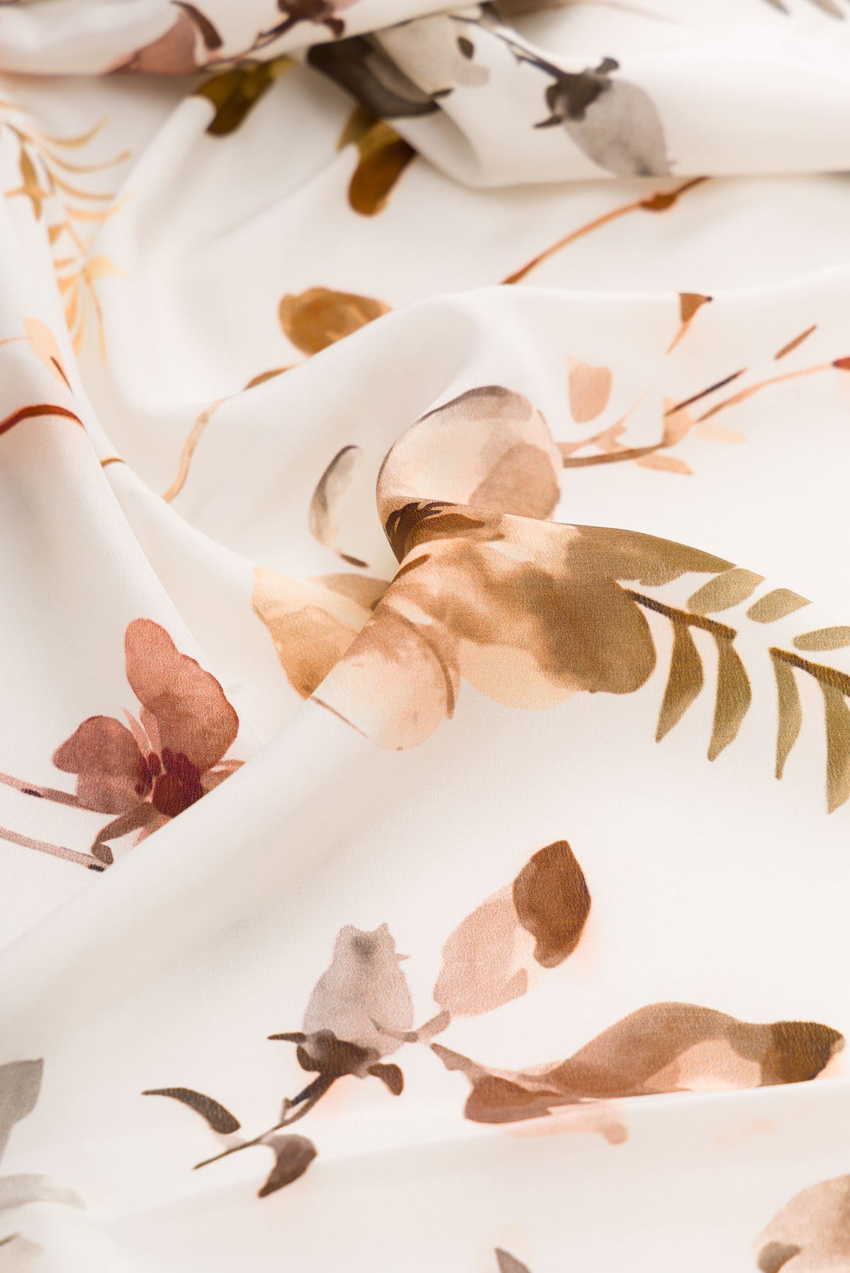 Close up of Off White Dual Tone Mysore Crepe Saree with Printed design on the body and Plain Border displaying folds