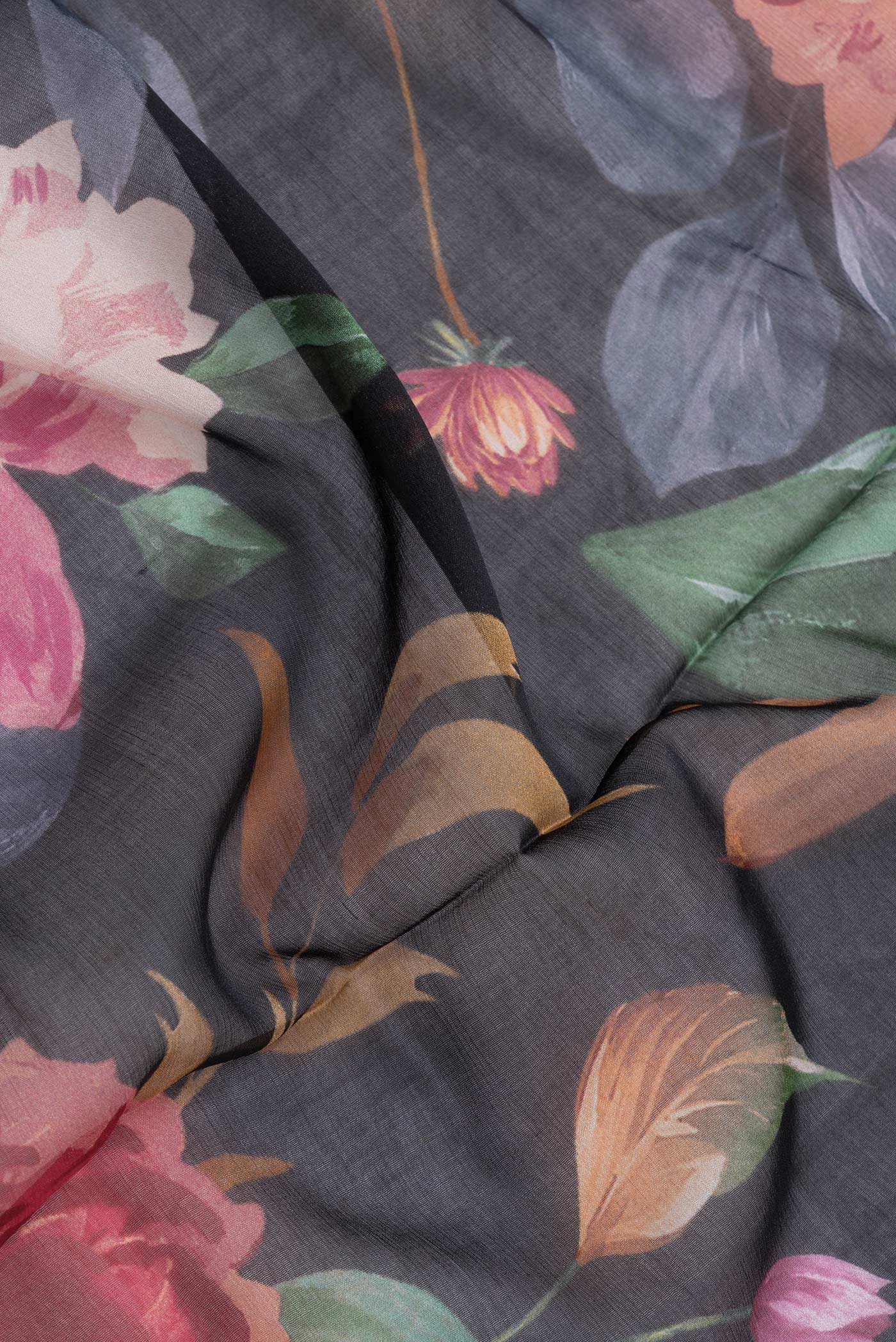 Close up of Black Dual Tone Chiffon Saree with Printed design on the body and Without Border.  displaying folds