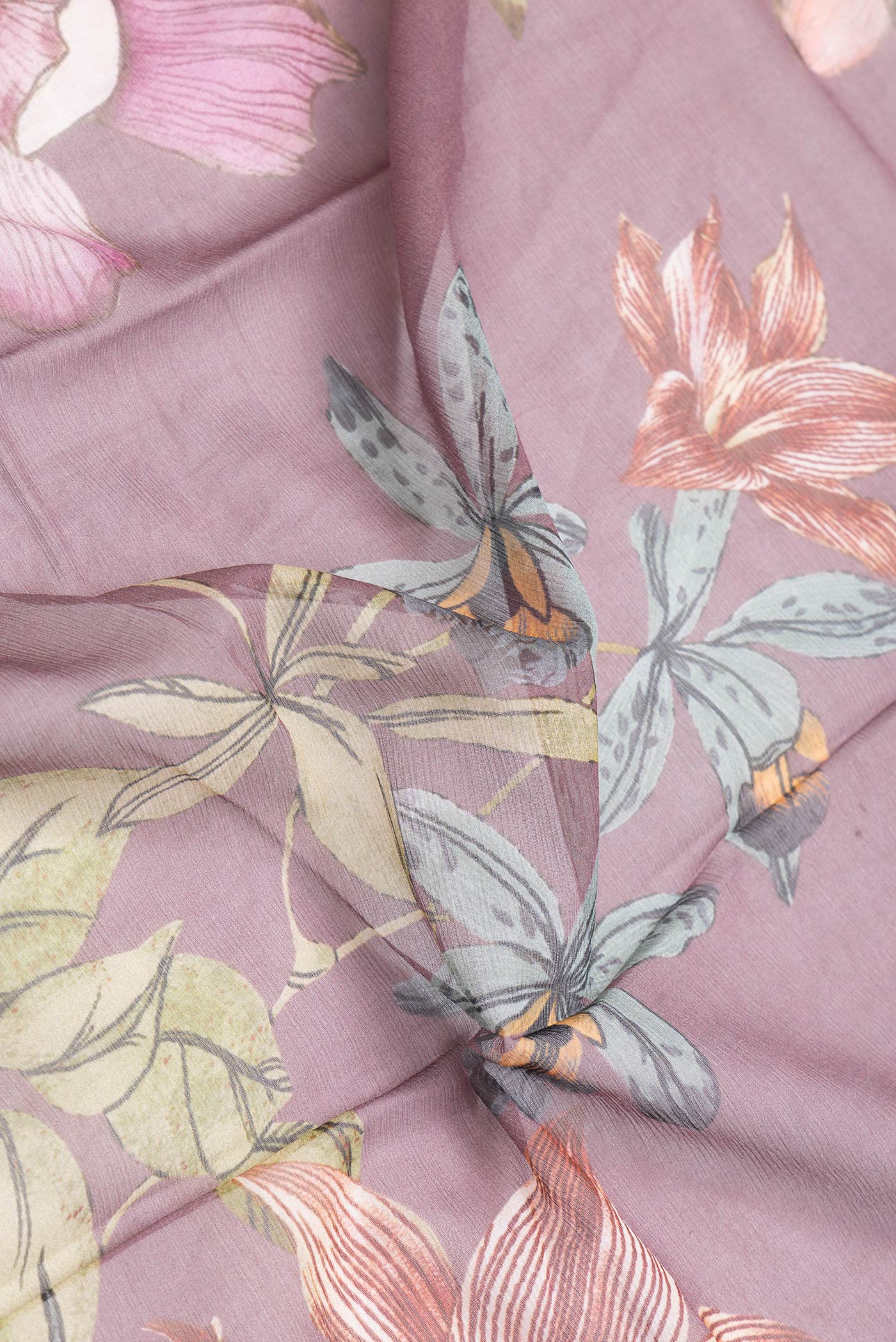 Close up of Purple Dual Tone Chiffon Saree with Printed design on the body and Without Border.  displaying folds