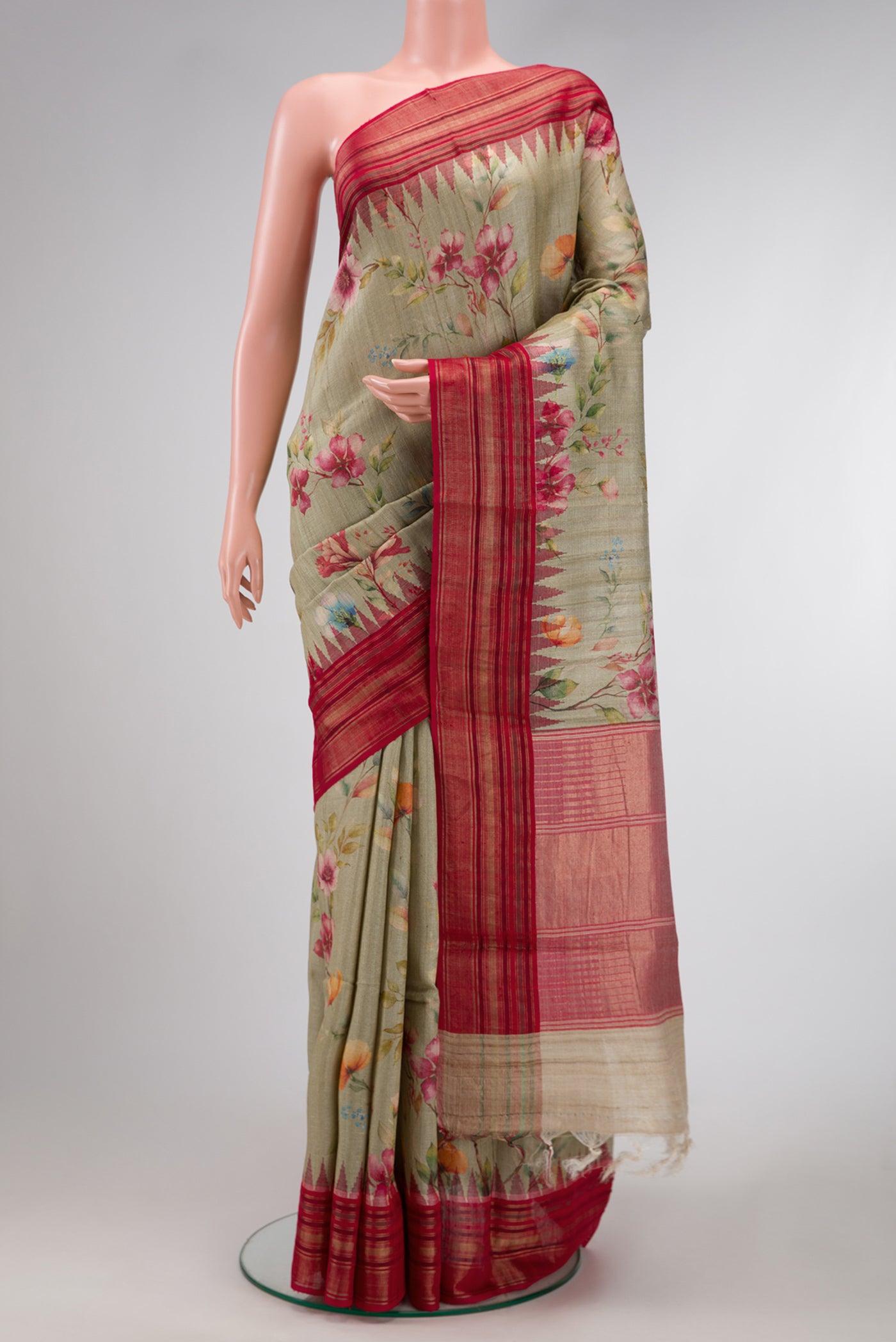 Pista Green Dual Tone Tussar Silk Saree with Printed design on the body and Zari Border.  displayed on a mannequin
