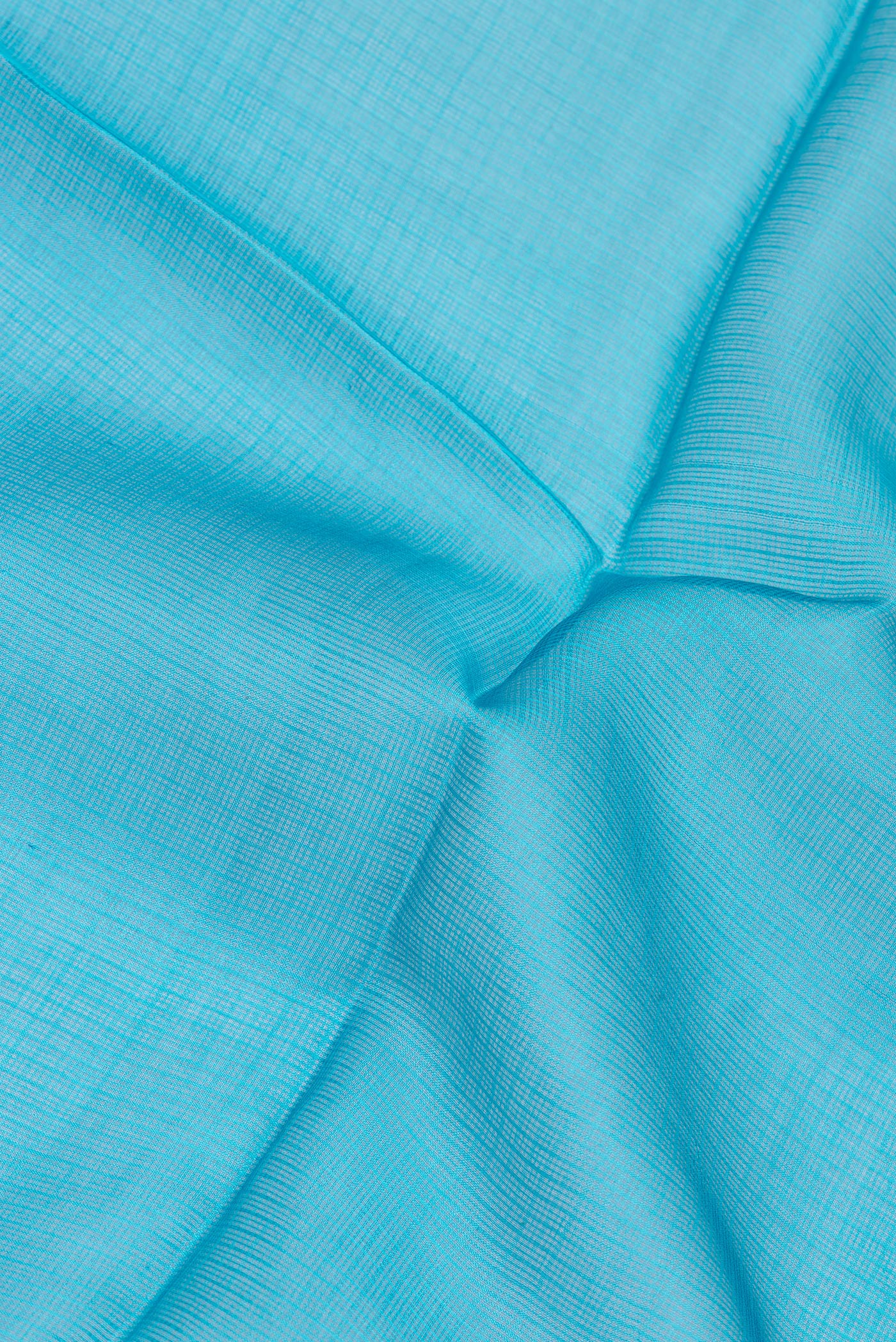 Close up of Sky Blue Kota Silk Saree with Checked design on the body and Thin Zari Line.  displaying folds