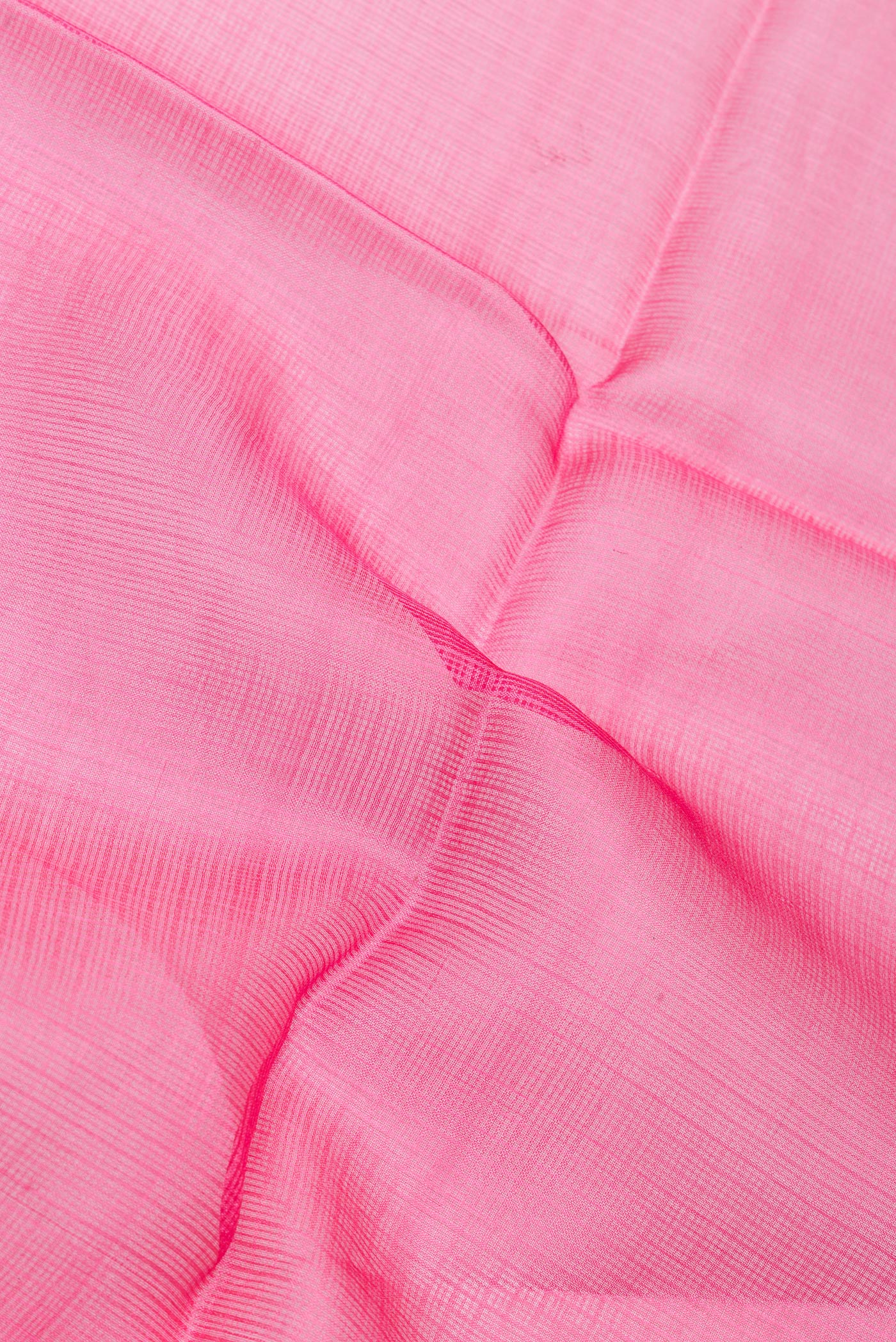 Close up of Pink Kota Silk Saree with Checked design on the body and Thin Zari Line.  displaying folds