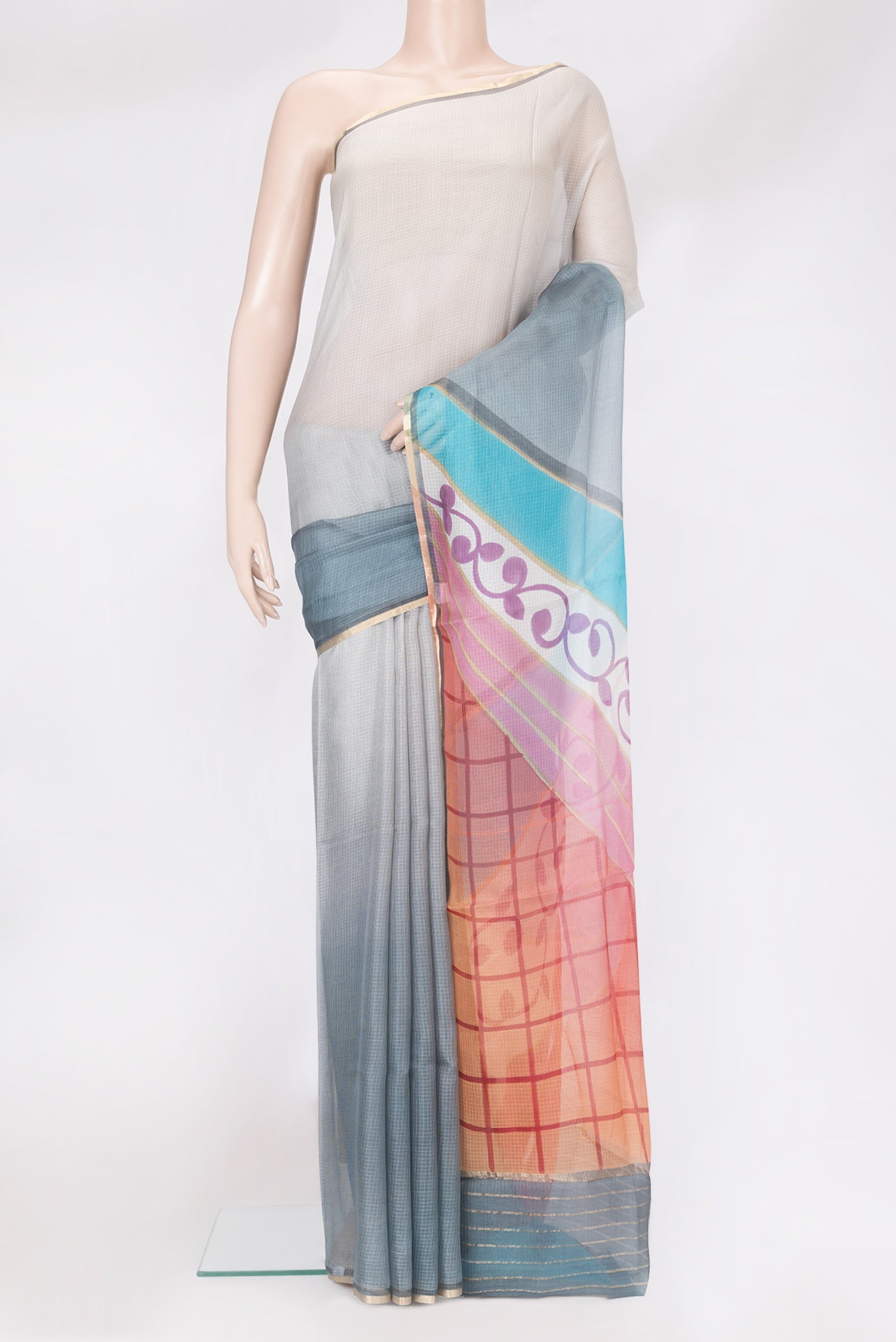 Grey Kota Silk Saree with Checked design on the body and Thin Zari Line.  displayed on a mannequin
