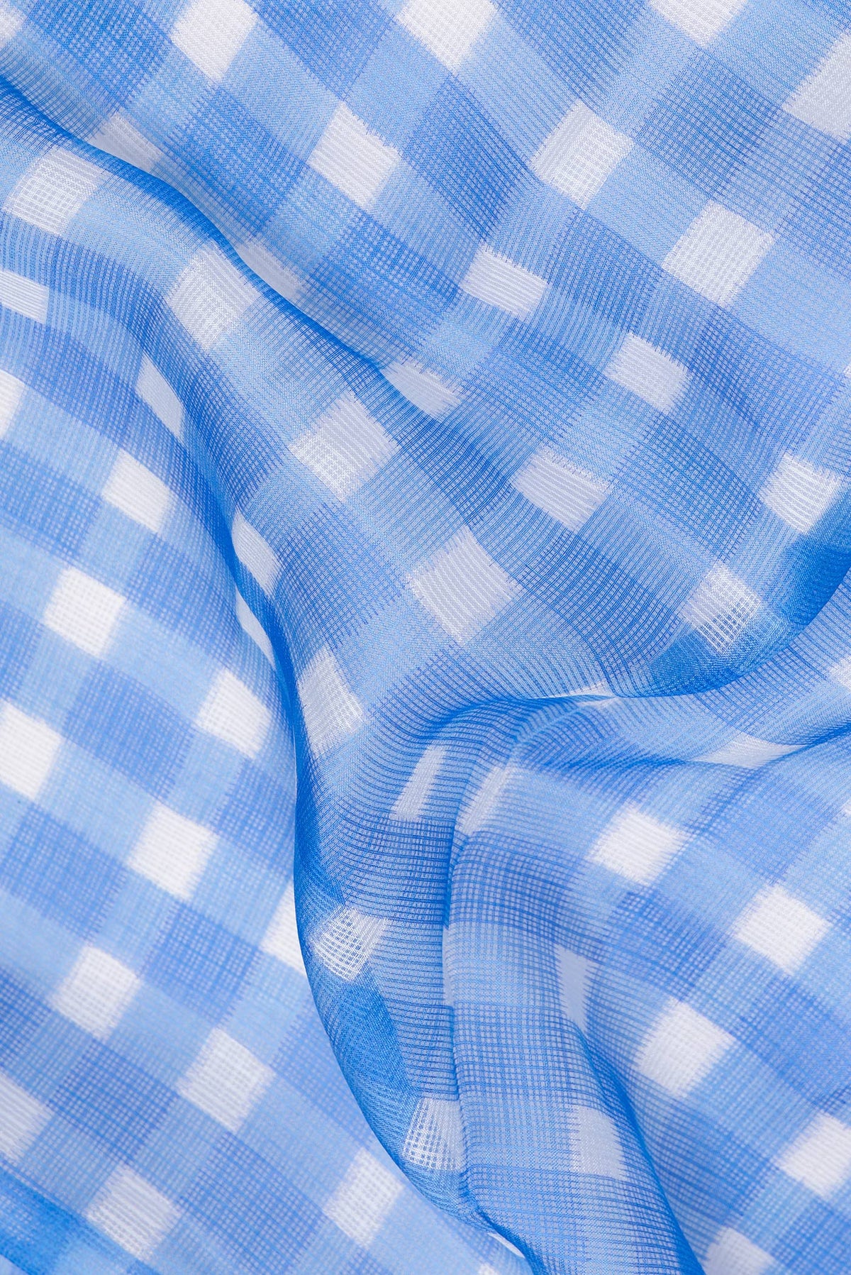 Close up of Sky Blue Kota Silk Saree with Checked design on the body and Thin Zari Line.  displaying folds