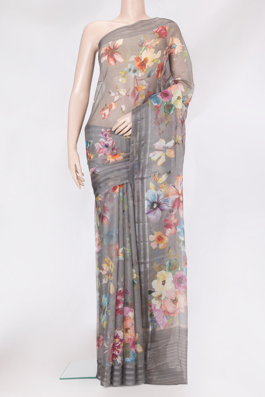 Grey Kota Silk Saree with Floral Print on the body and Plain Border.  displayed on a mannequin