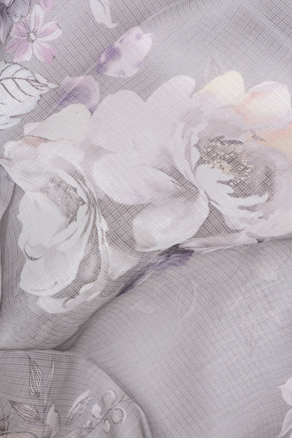 Close up of Grey Kota Silk Saree with Floral Print on the body and Plain Border.  displaying folds