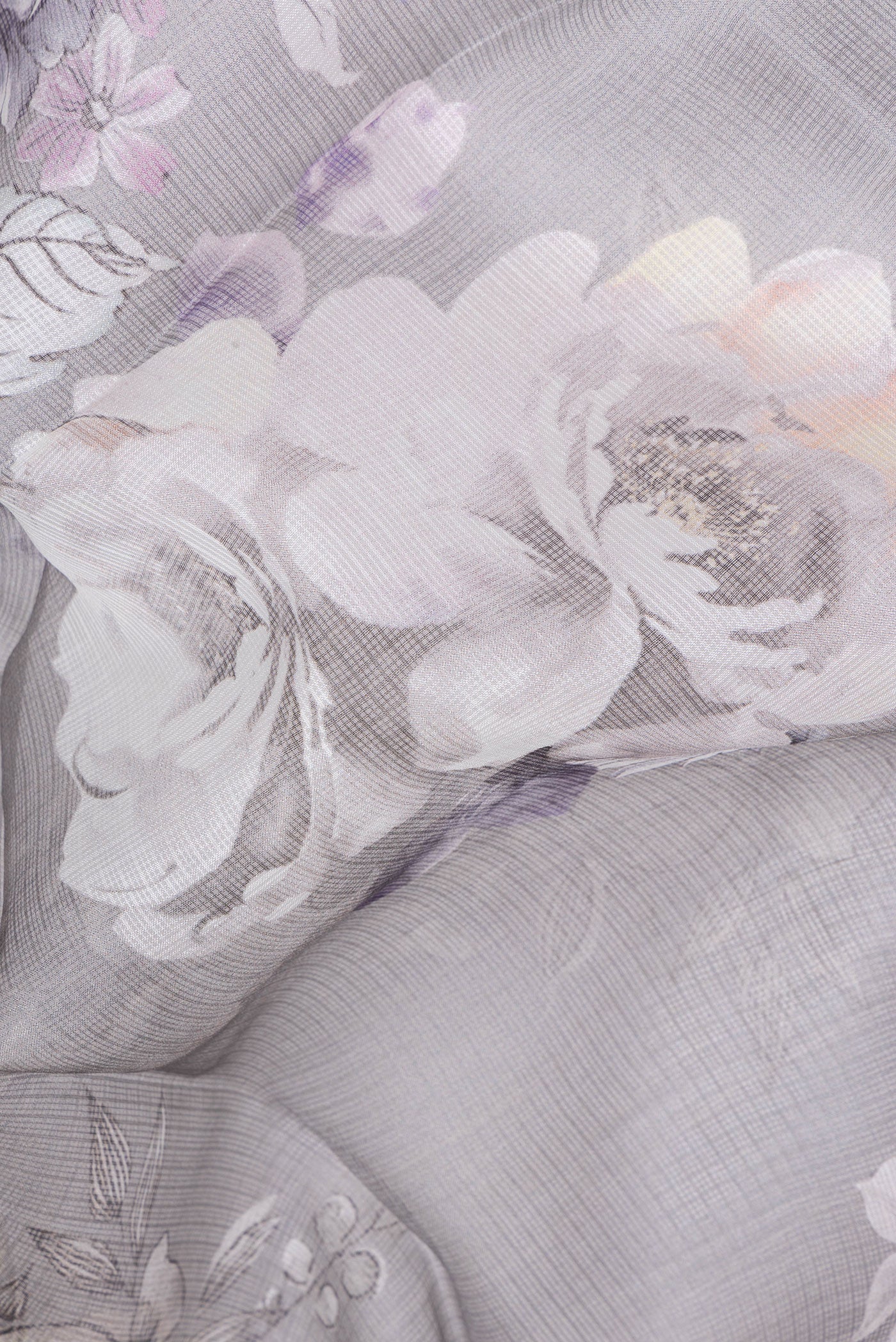 Close up of Grey Kota Silk Saree with Floral Print on the body and Plain Border.  displaying folds