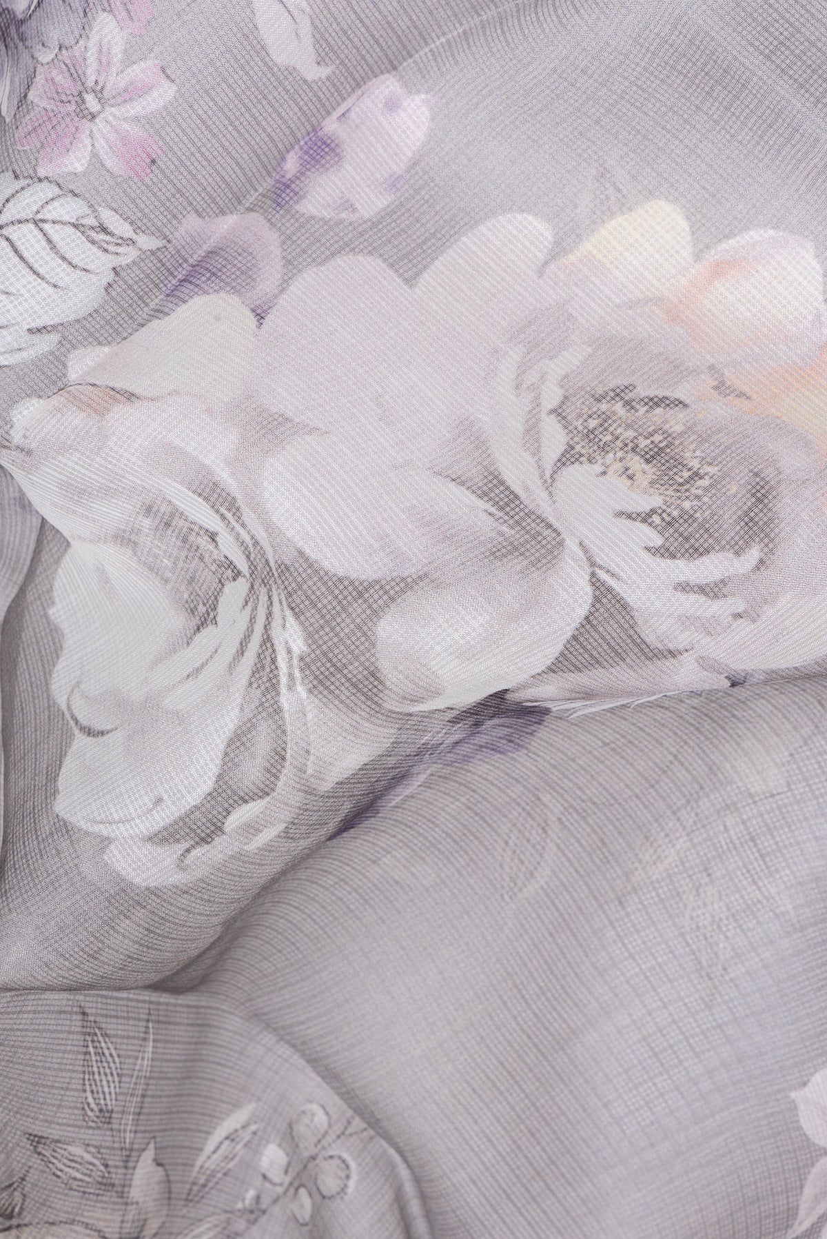 Close up of Grey Kota Silk Saree with Floral Print on the body and Plain Border.  displaying folds