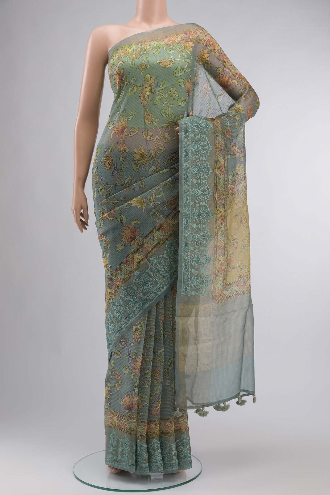 Green Organza Silk Saree Printed design on the body and Embroidery Border displayed on a mannequin