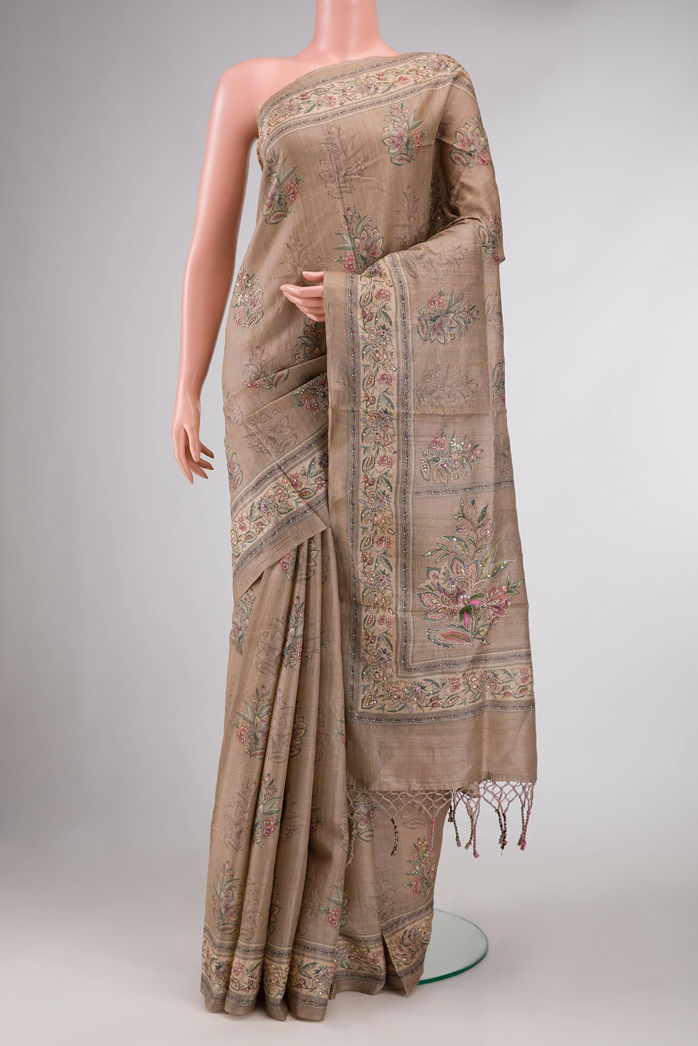Dark Beige Dual Tone Tussar Silk Saree with Printed design on the body and Printed Border displayed on a mannequin