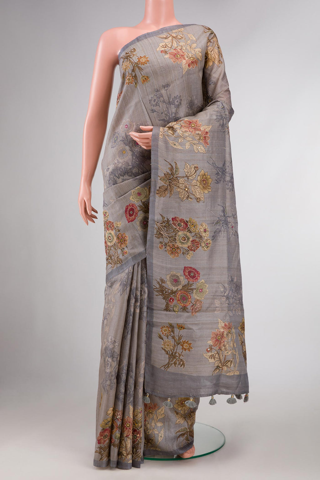 Grey Dual Tone Tussar Silk Saree with Embroidery on the body and Plain Border displayed on a mannequin