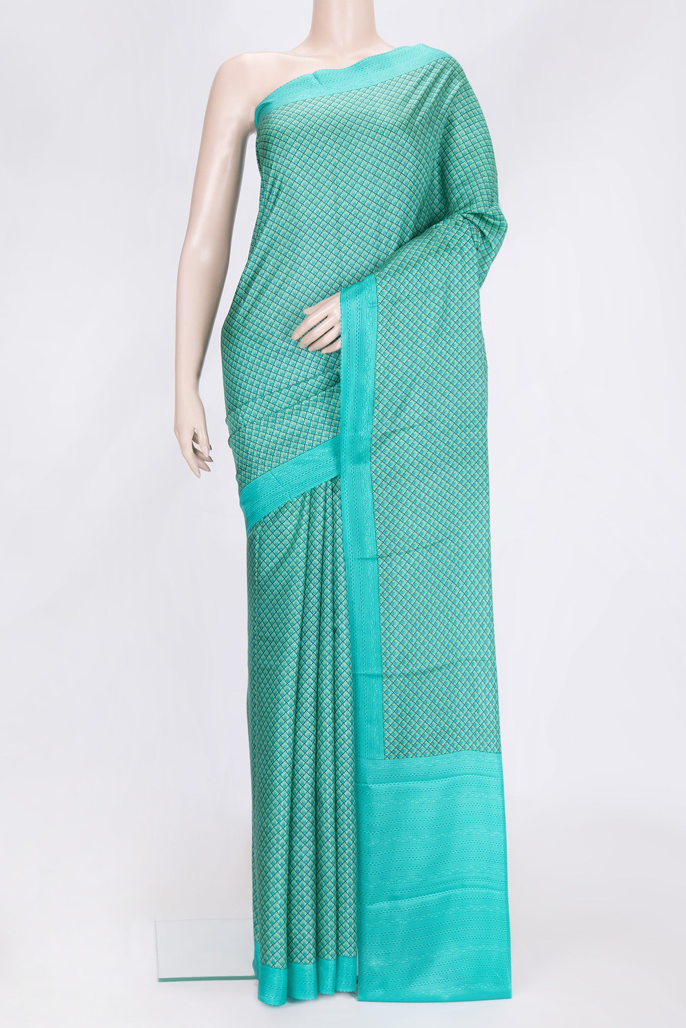Sea Green Dual Tone Printed Silk Saree with Printed design on the body and Printed Border.  displayed on a mannequin