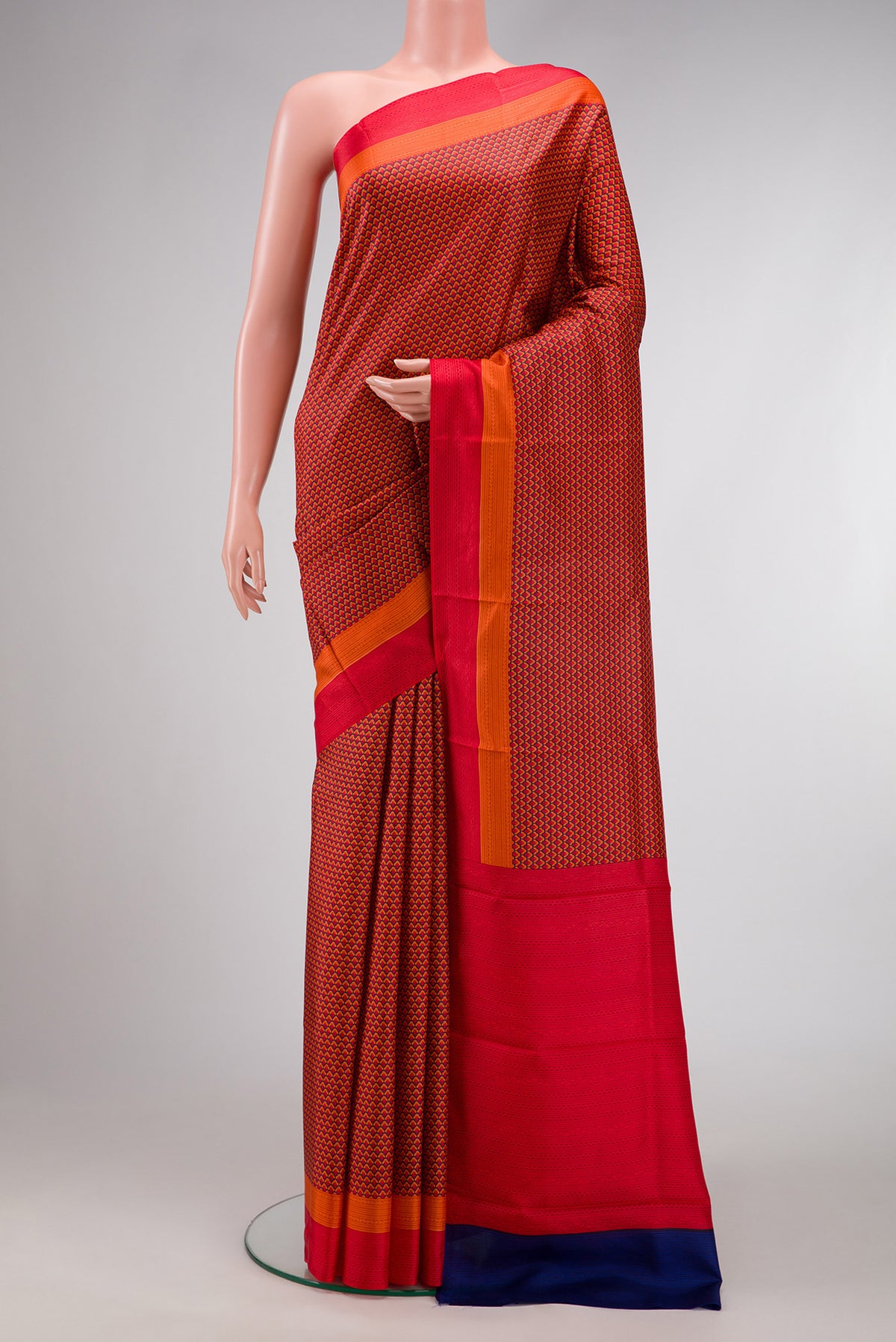 Red Dual Tone Printed Silk Saree with Printed design on the body and Printed Border.  displayed on a mannequin