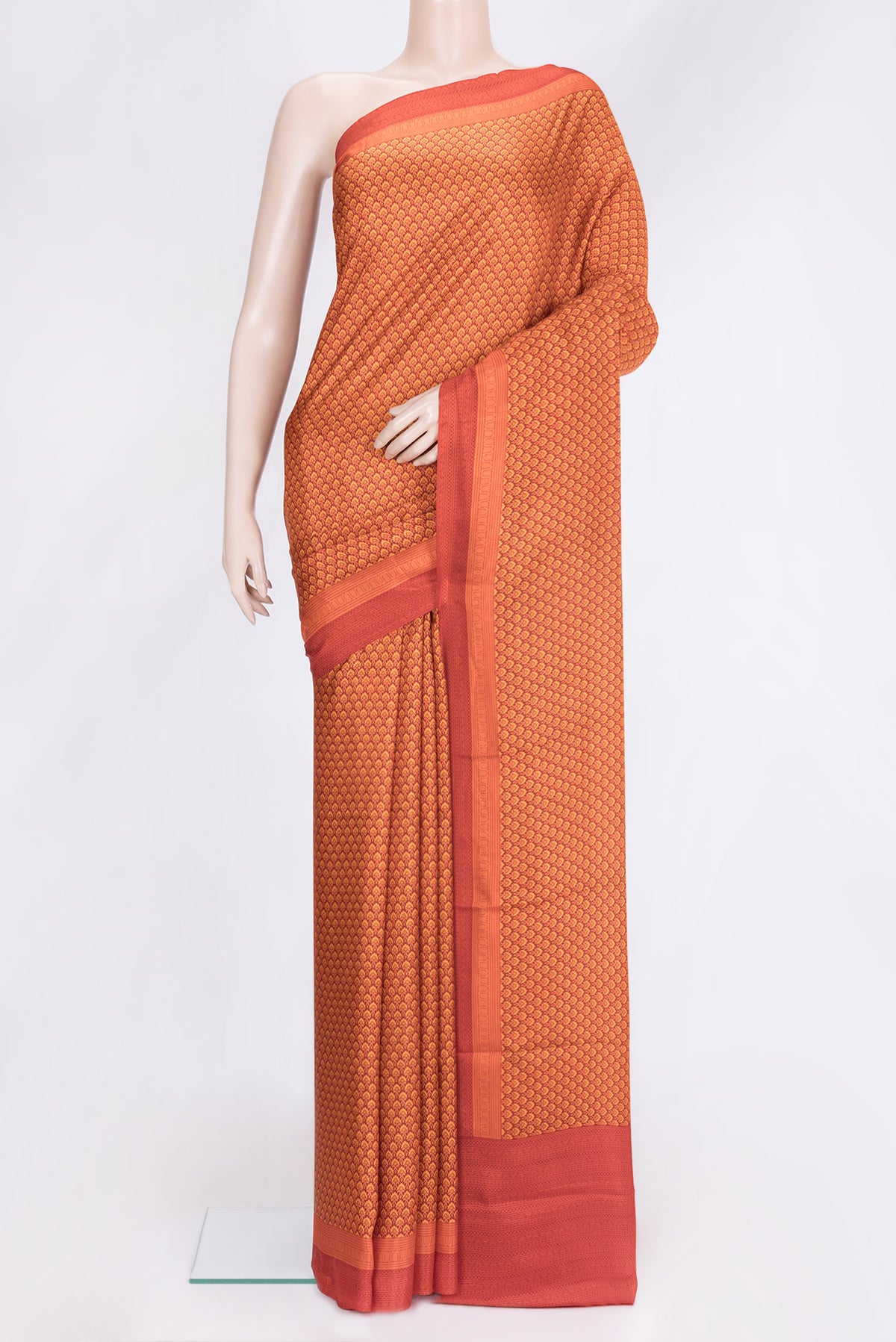 Orange Dual Tone Printed Silk Saree with Printed design on the body and Printed Border.  displayed on a mannequin