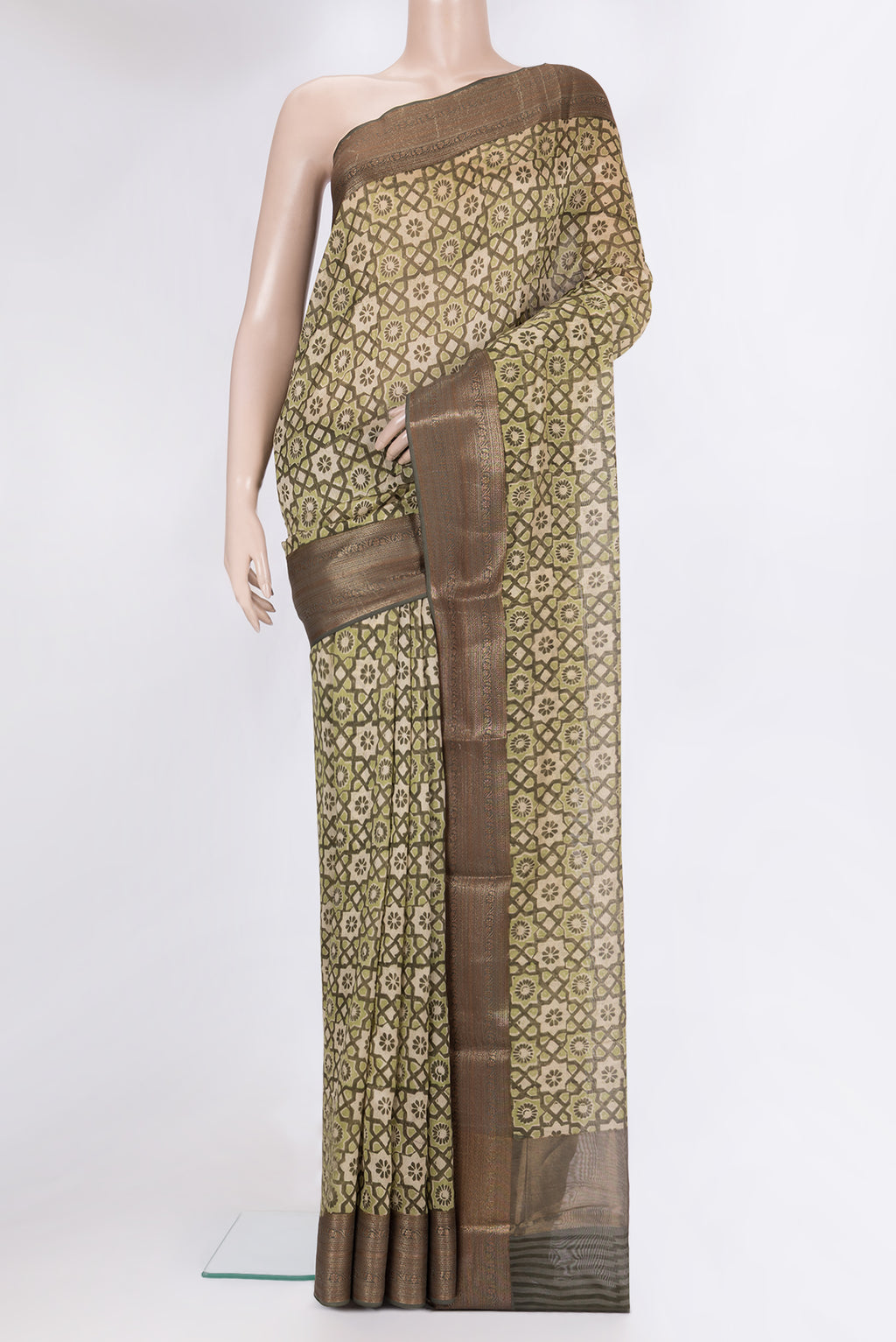 Green Chanderi Silk Saree with Printed design on the body and Fancy Border.  displayed on a mannequin