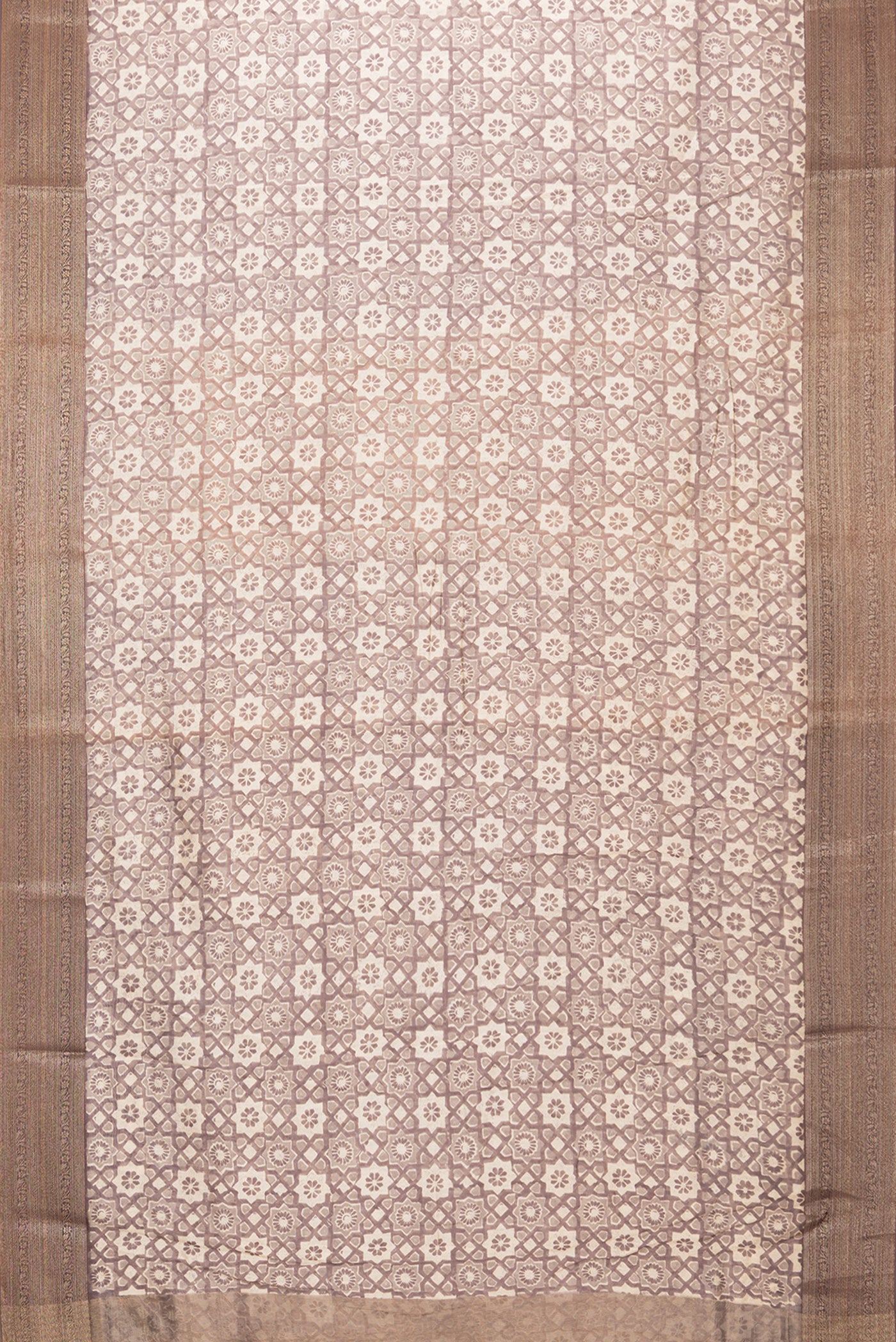 Flat view of Brown Dual Tone Chanderi Silk Saree with Printed design on the body and Zari Border. 