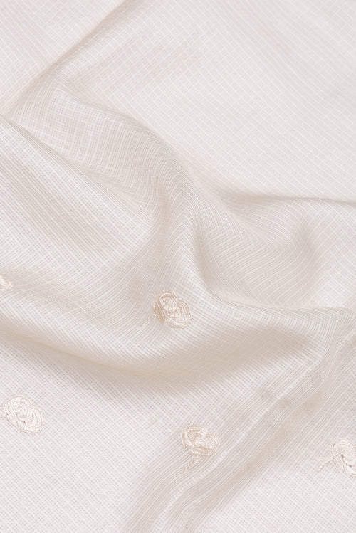 Close up of Beige Kota Silk Saree with Embroidery on the body and Embroidery Border.  displaying folds