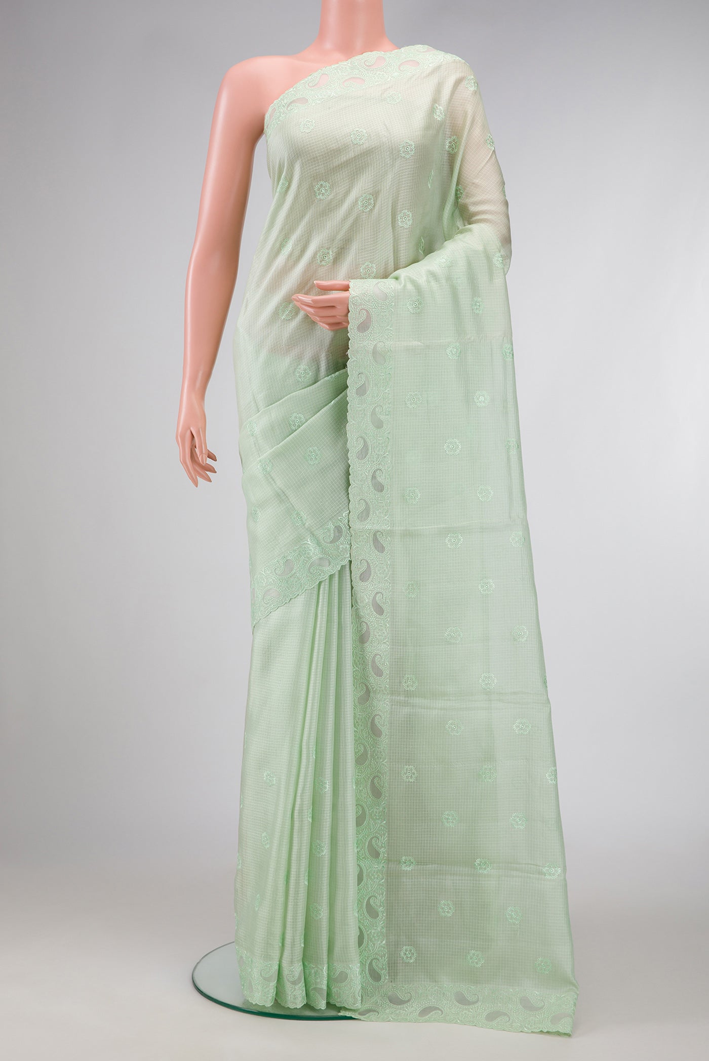 Pista Green Dual Tone Kota Silk Saree with Embroidery on the body and Embroidery Border.  displayed on a mannequin