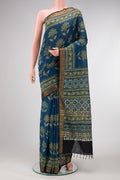 Navy Blue Dual Tone Cotton Saree with Ajrakh Print on the body and Zari Border.  displayed on a mannequin